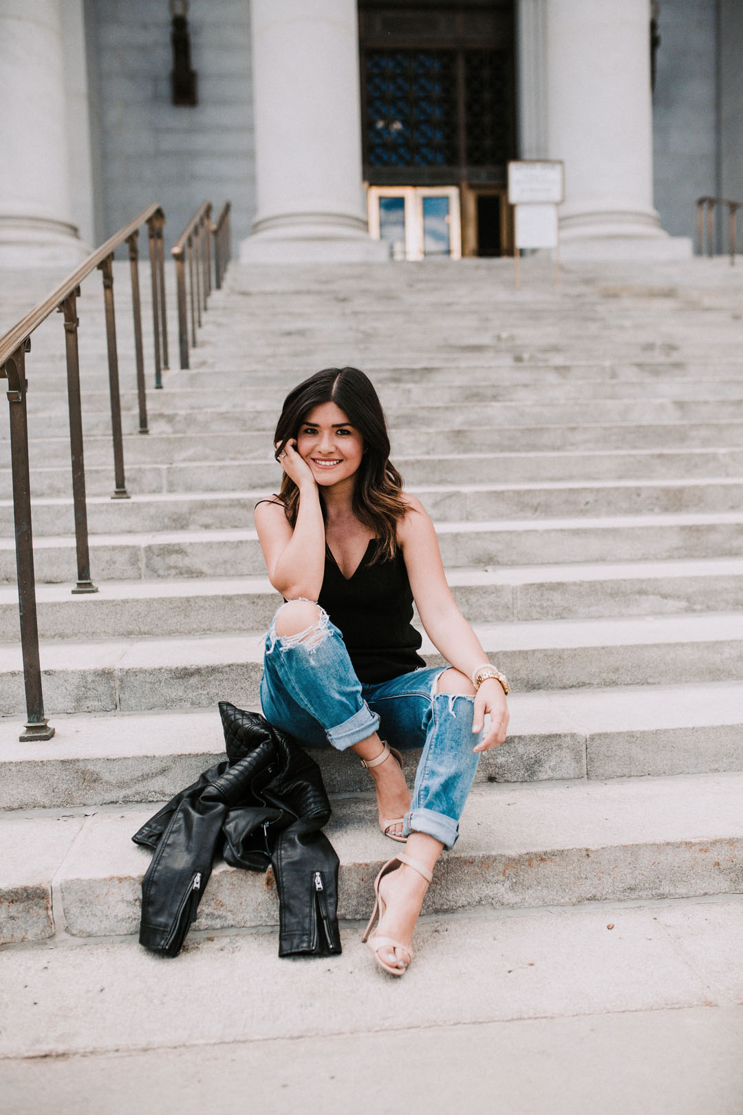 Carolina Hellal of Chic Talk wearing American Eagle tomgirl jeans, Bailey44 black top, and Topshop black faux leather jacket