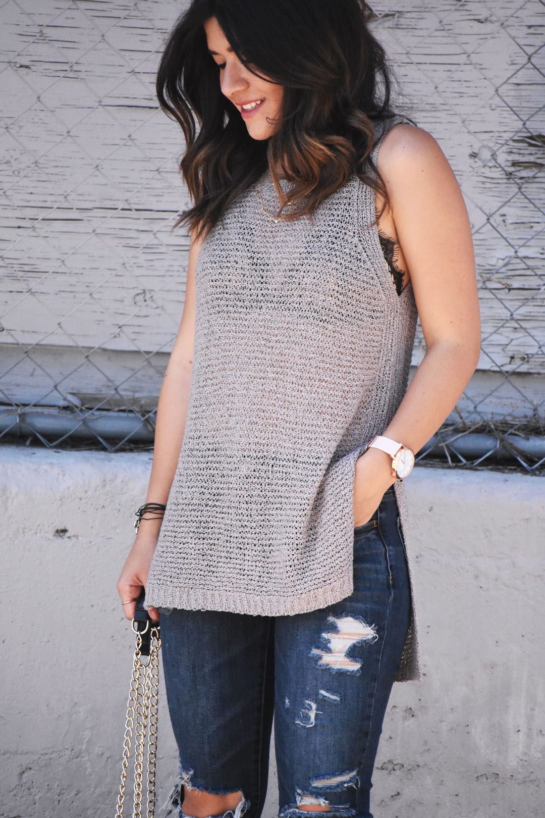 Carolina Hellal of Chic Talk wearing an ASTR the label knit top, a forever 21 black bralette, and American Eagle jeans.