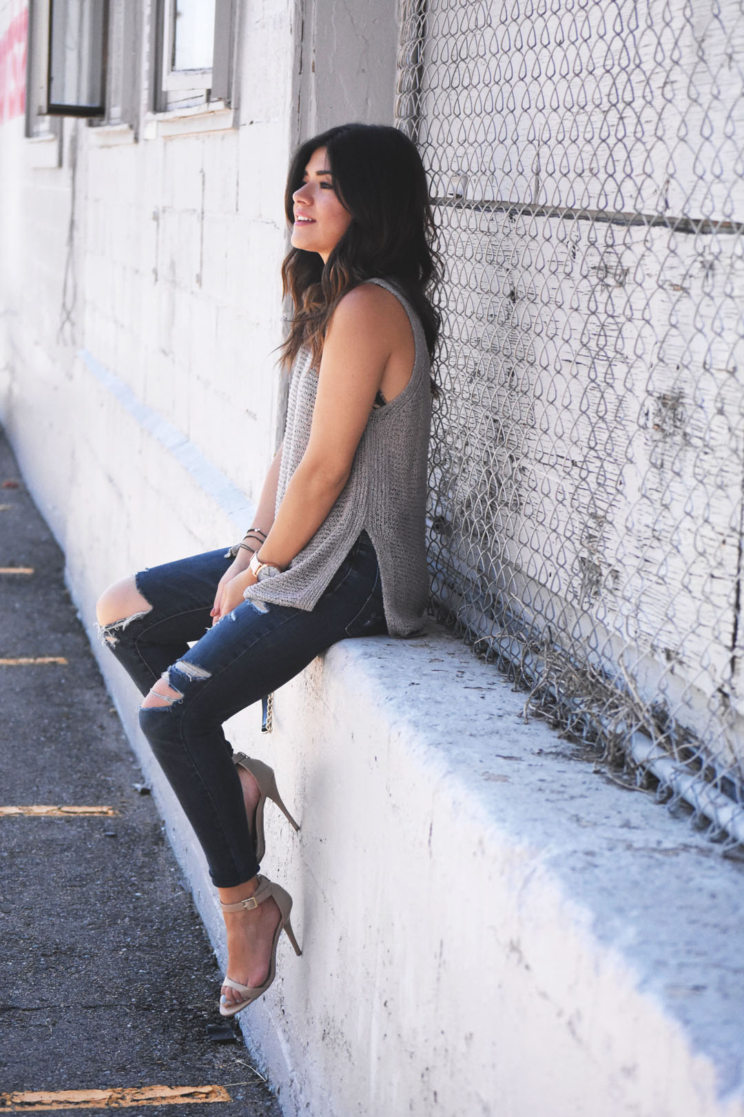 Carolina Hellal of Chic Talk wearing a ASTR knit top and American Eagle ripped jeans.
