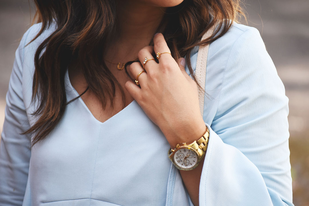 Carolina Hellal of Chic Talk wearing a Timex gold watch, Gorjana gold necklace and Pueblo L.A dainty gold rings
