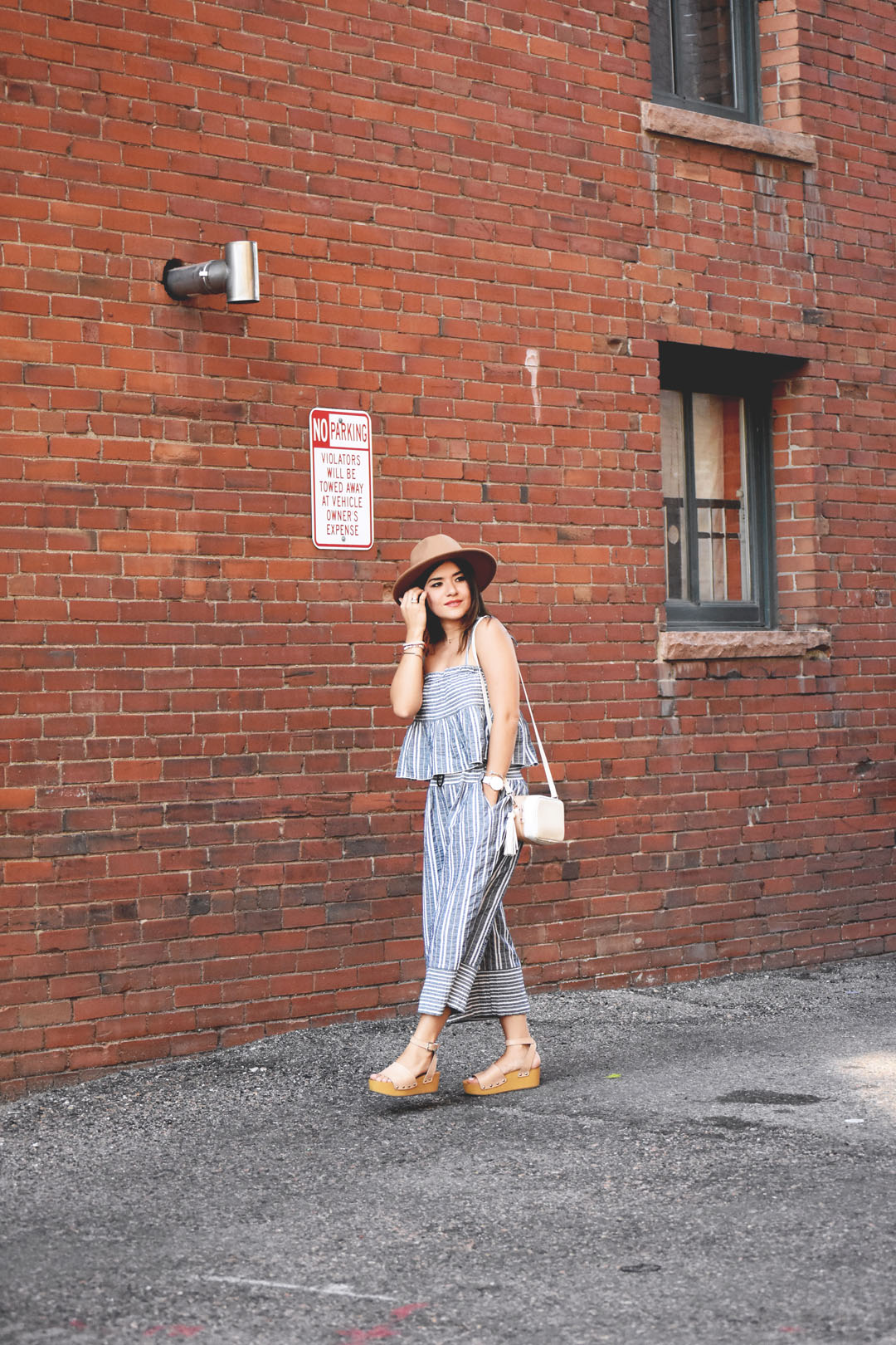 Carolina Hella of Chic Talk Fashion blog wearing a Chicwish set of striped top and pants, Forever 21 brown hat and Sam Edelman platforms