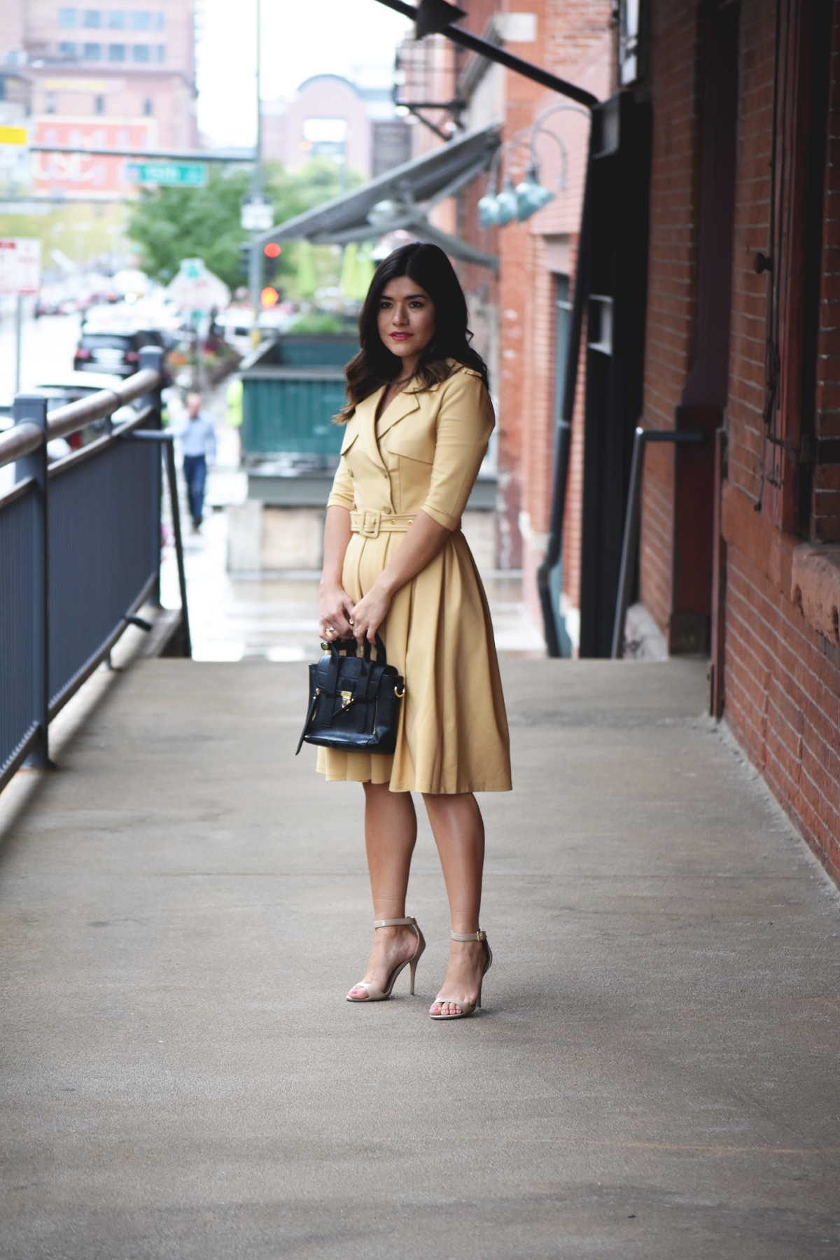 Carolina Hellal of Chic Talk wearing a Chicwish beige trench dress and Mellow Handbag World bag, and beige strap sandals