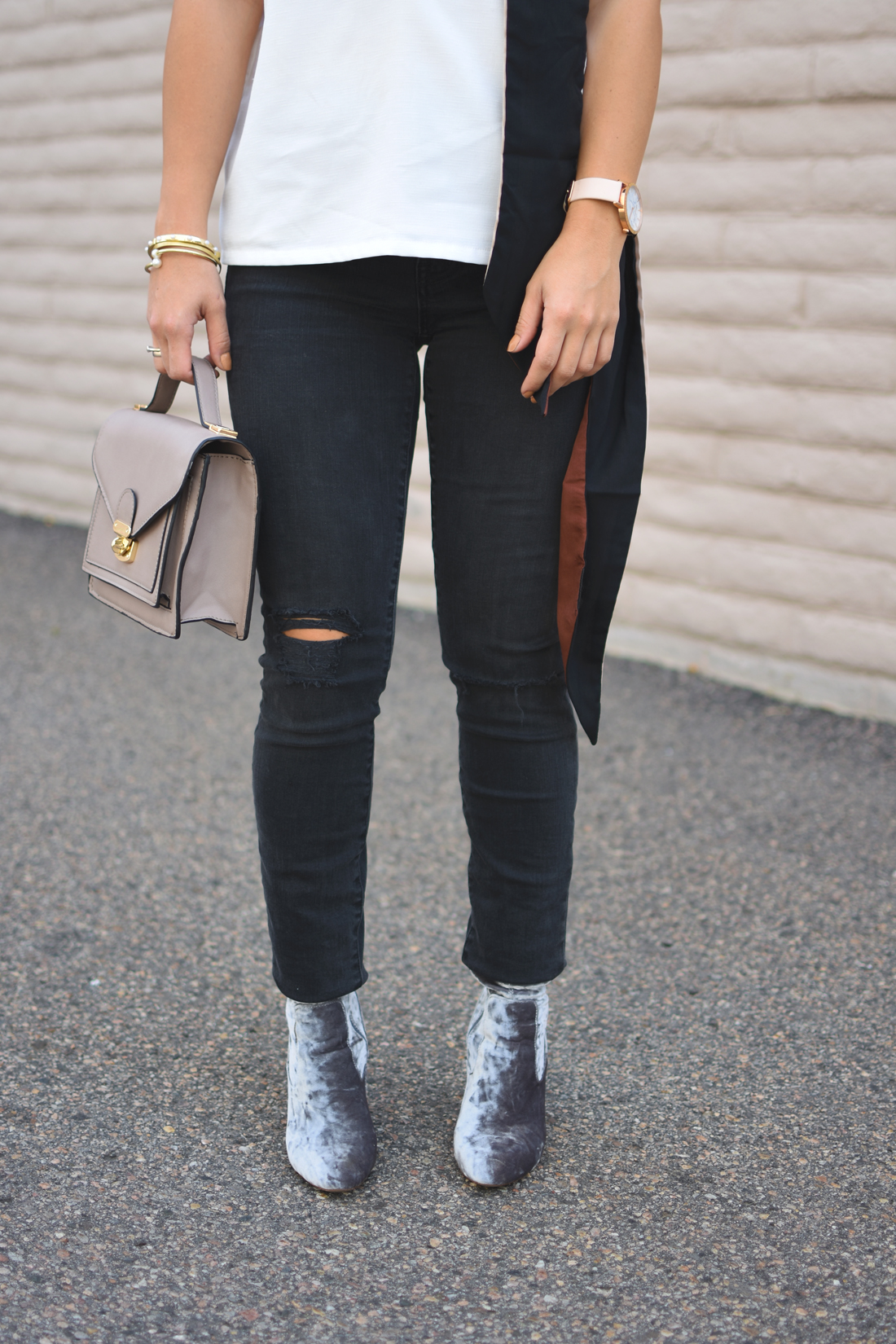Carolina Hellal of Chic Talk wearing a Tobi white top, Madewell ripped jeans, Public Desire velvet boots and H&M scarf