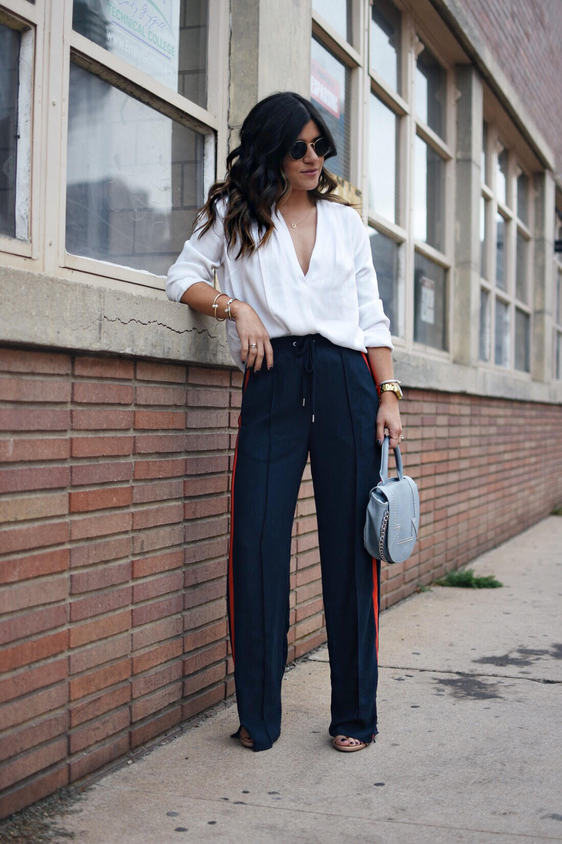 Carolina Hellal of the fashion blog chic talk wearing H&M navy blue track pants