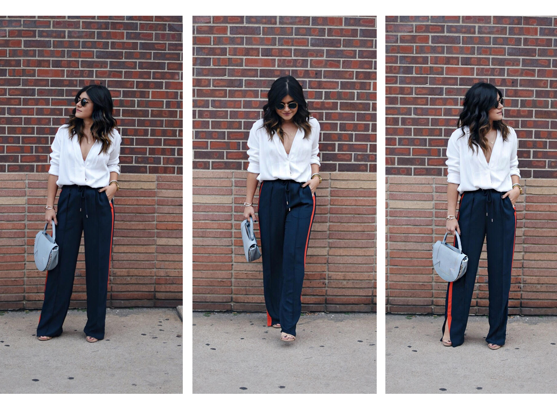 Carolina Hellal of Chic Talk wearing H&M navy blue track pants, white cross front blouse and Rayban Rounded 50mm sunglasses