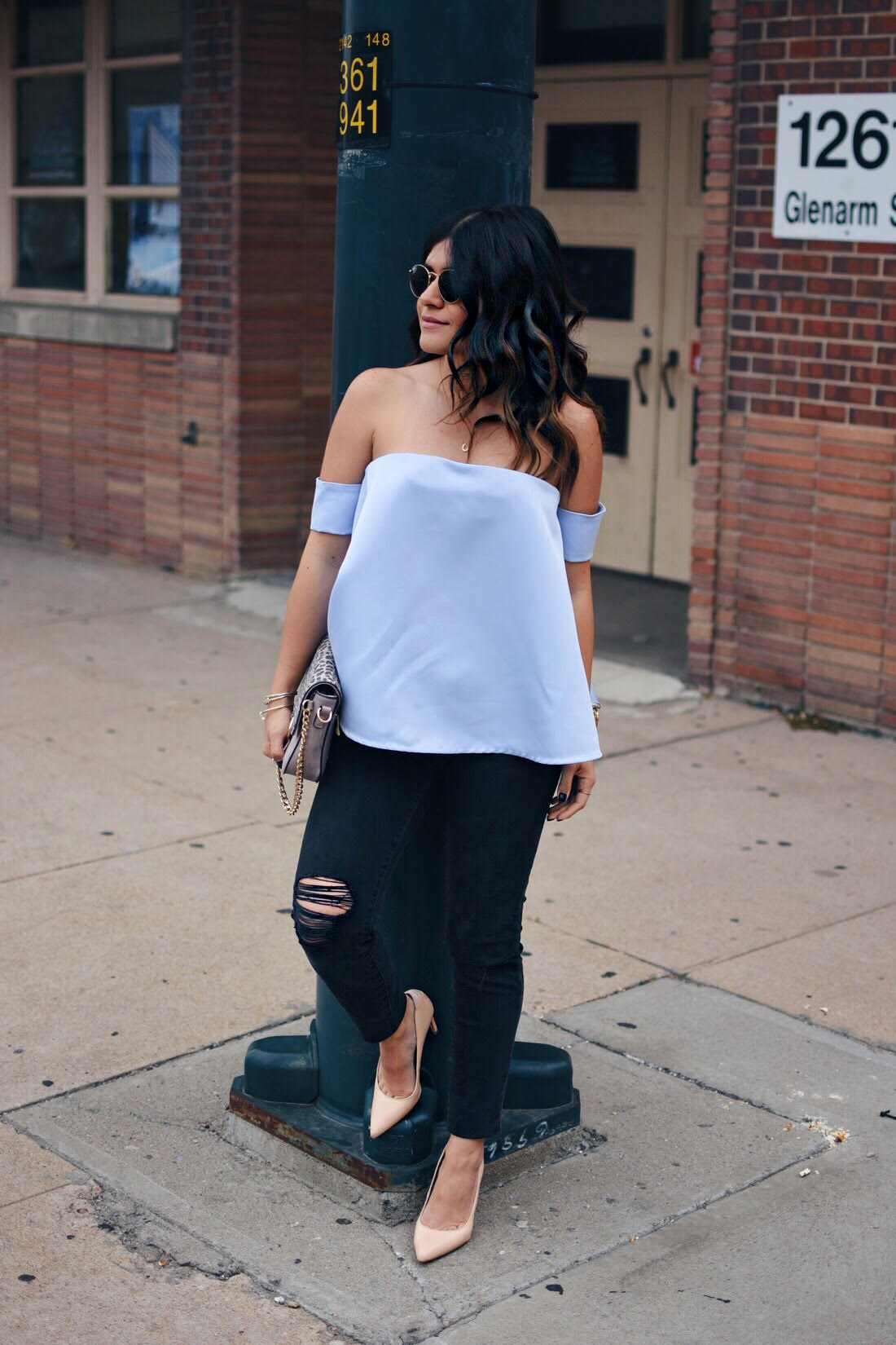 Carolina Hellal of Chic Talk wearing a chicwish strapless top, madewell jeans and Sam Edelman pumps