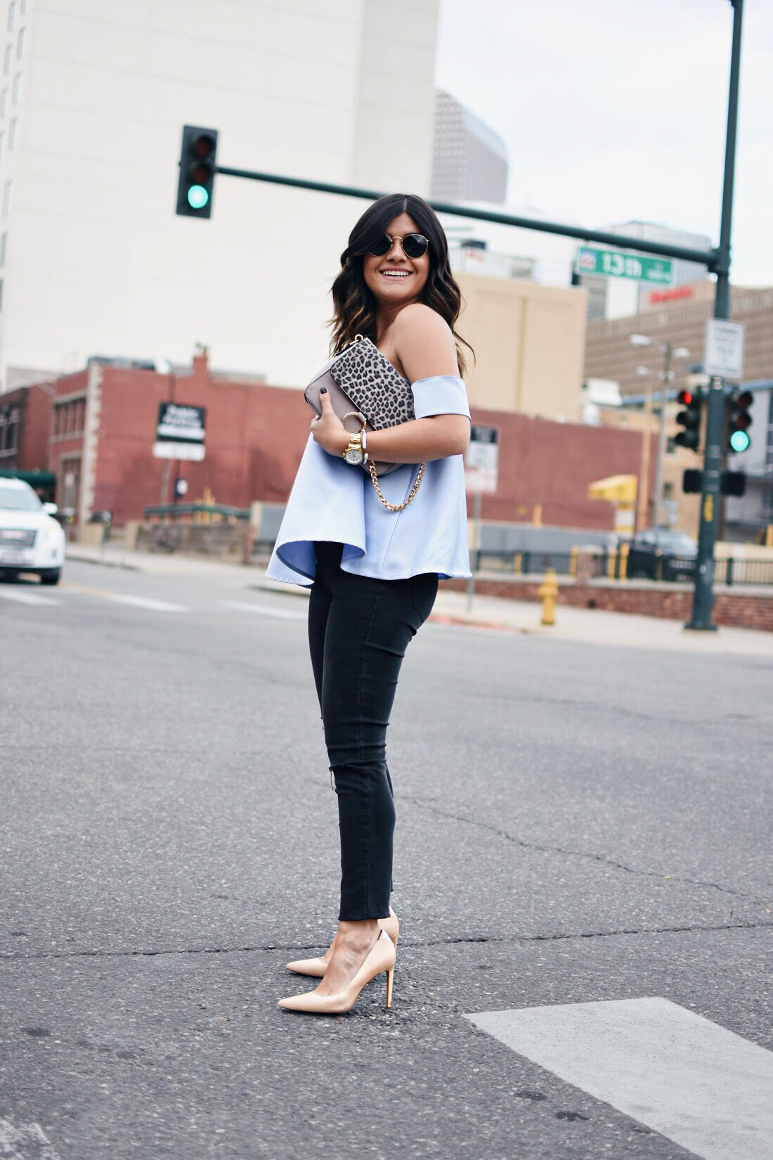 Carolina Hellal of Chicwish wearing a Chicwish strapless top, madewell jeans and Rayban sunglasses