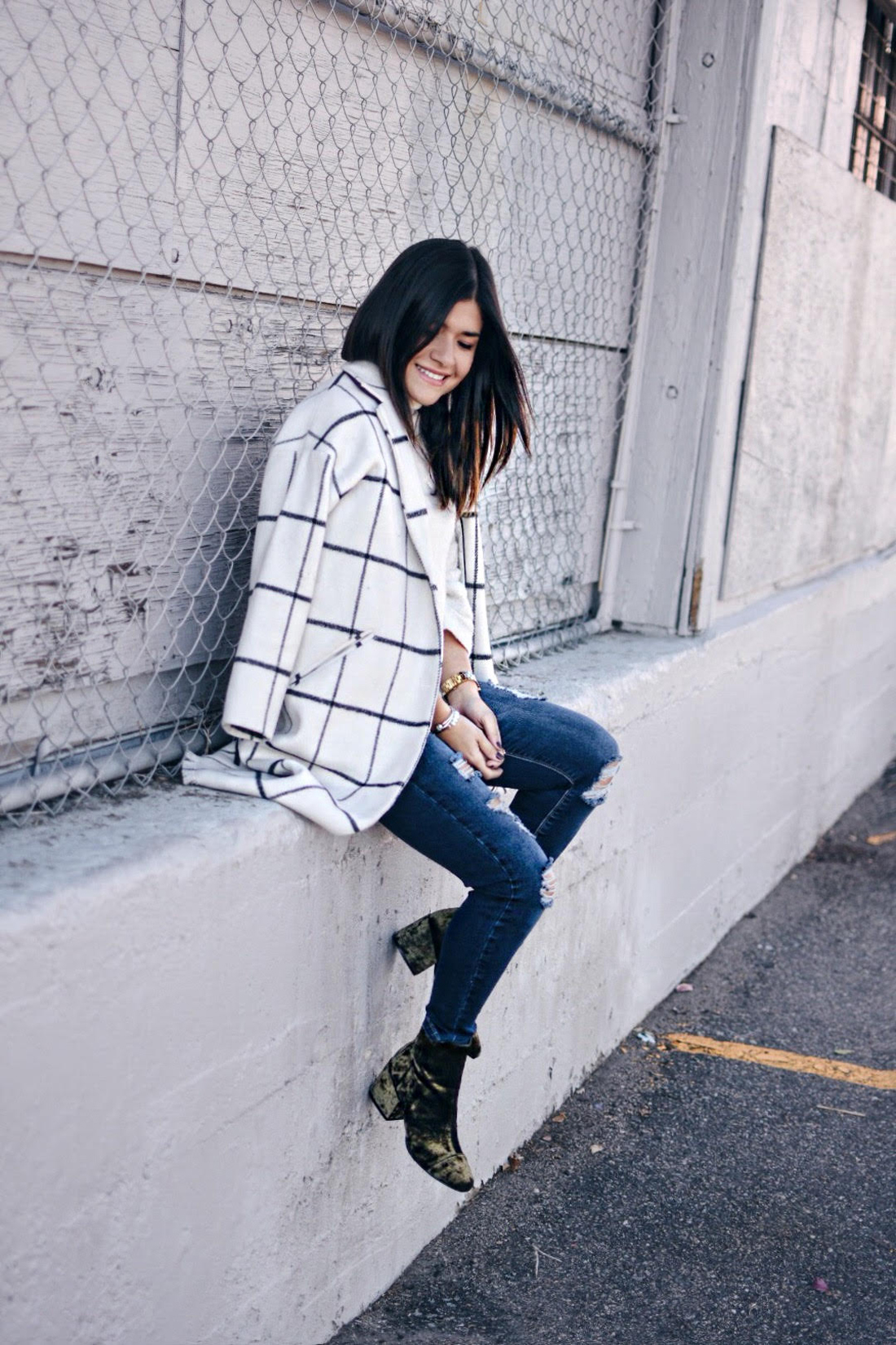 Carolina Hellal of Chic Talk wearing a Chicwish plaid coat, american eagle jeans, EGO green velvet booties, and forever21 beige sweater