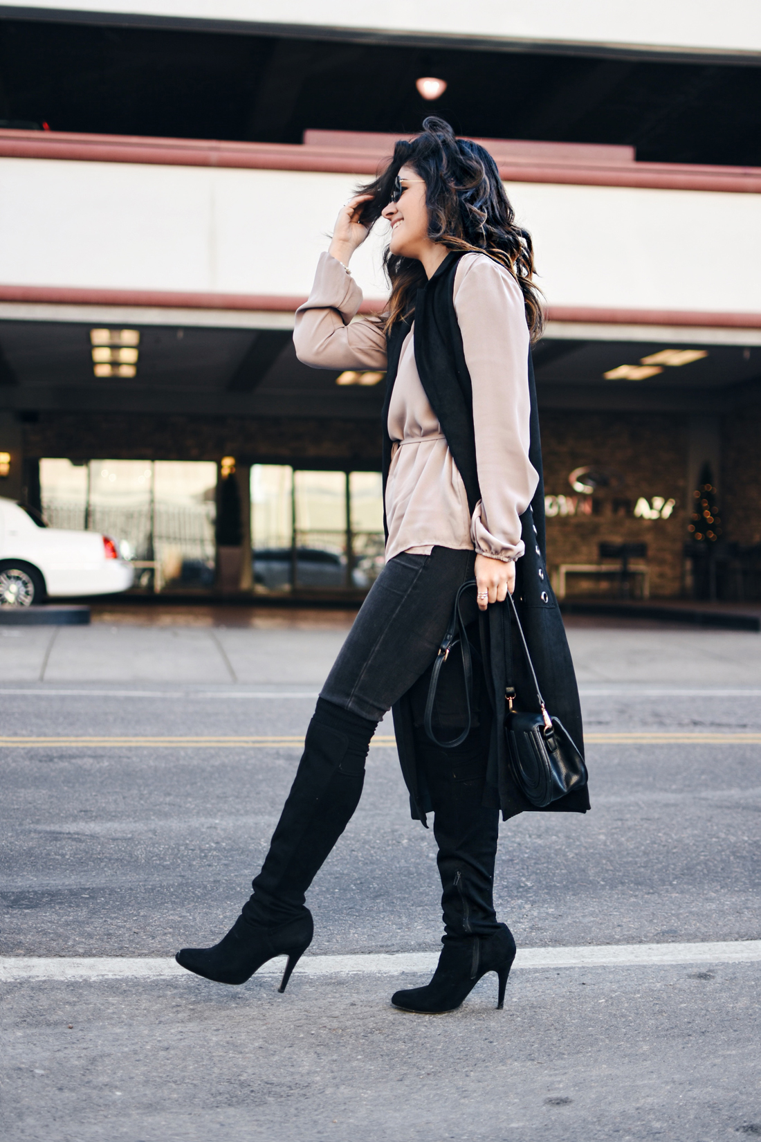 Carolina Hellal of Chic Talk wearing a VIPme black long vest, Forever21 top, Over the knee boots, and Rayban sunglasses
