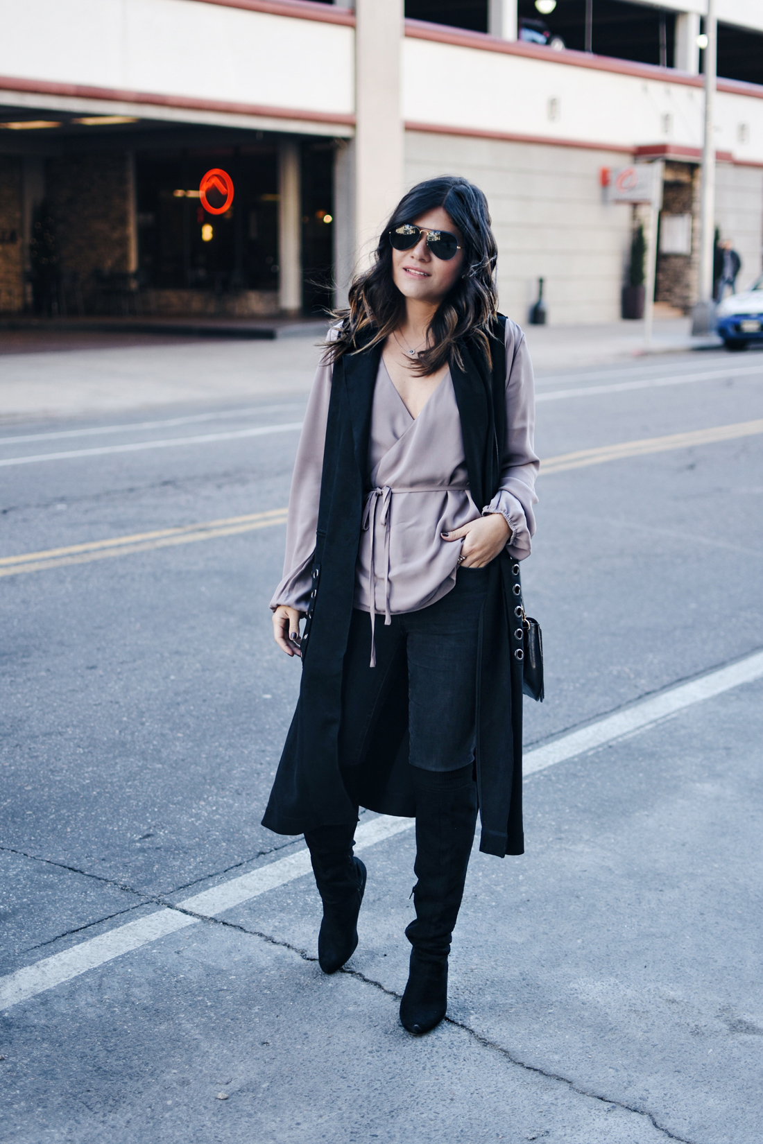 Carolina Hellal of Chic Talk wearing a VIPme black long vest, Forever21 top, Over the knee boots, and Rayban sunglasses