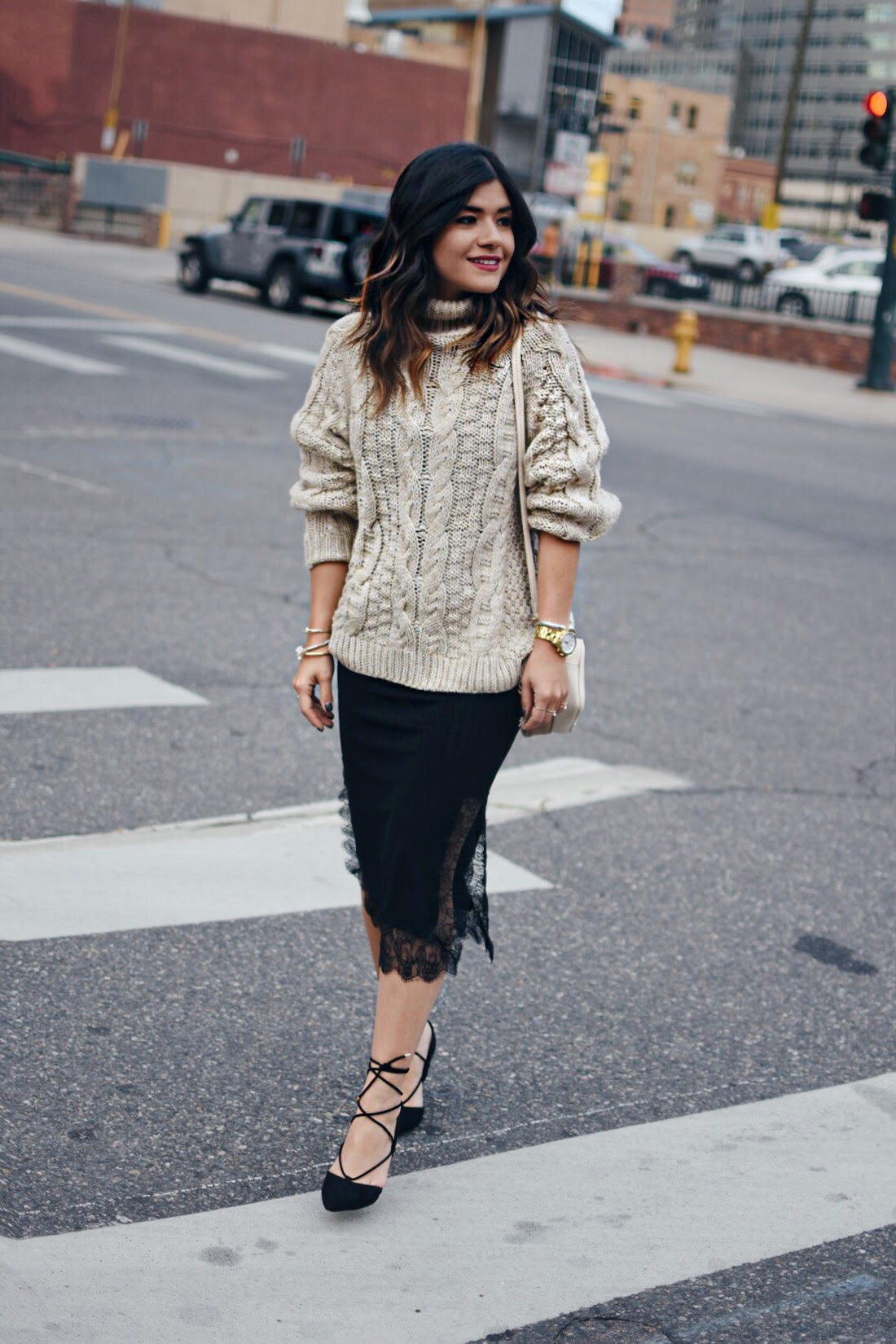 Carolina Hellal of Chic Talk wearing an H&M knit dress, black slip lace dress, and Aldo lace up pointy shoes. 