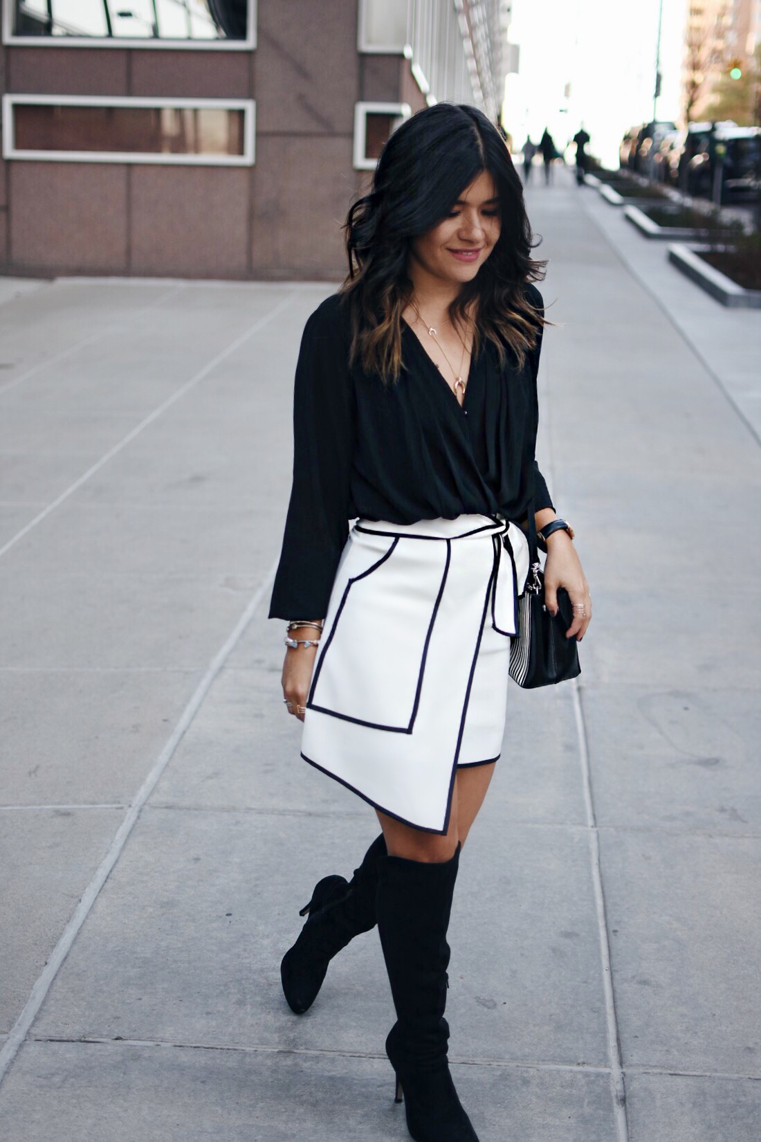 Carolina Hellal of Chic Talk wearing a white asymmetrical Chicwish skirt, Forever21 chiffon top and Suede Knee high boots.