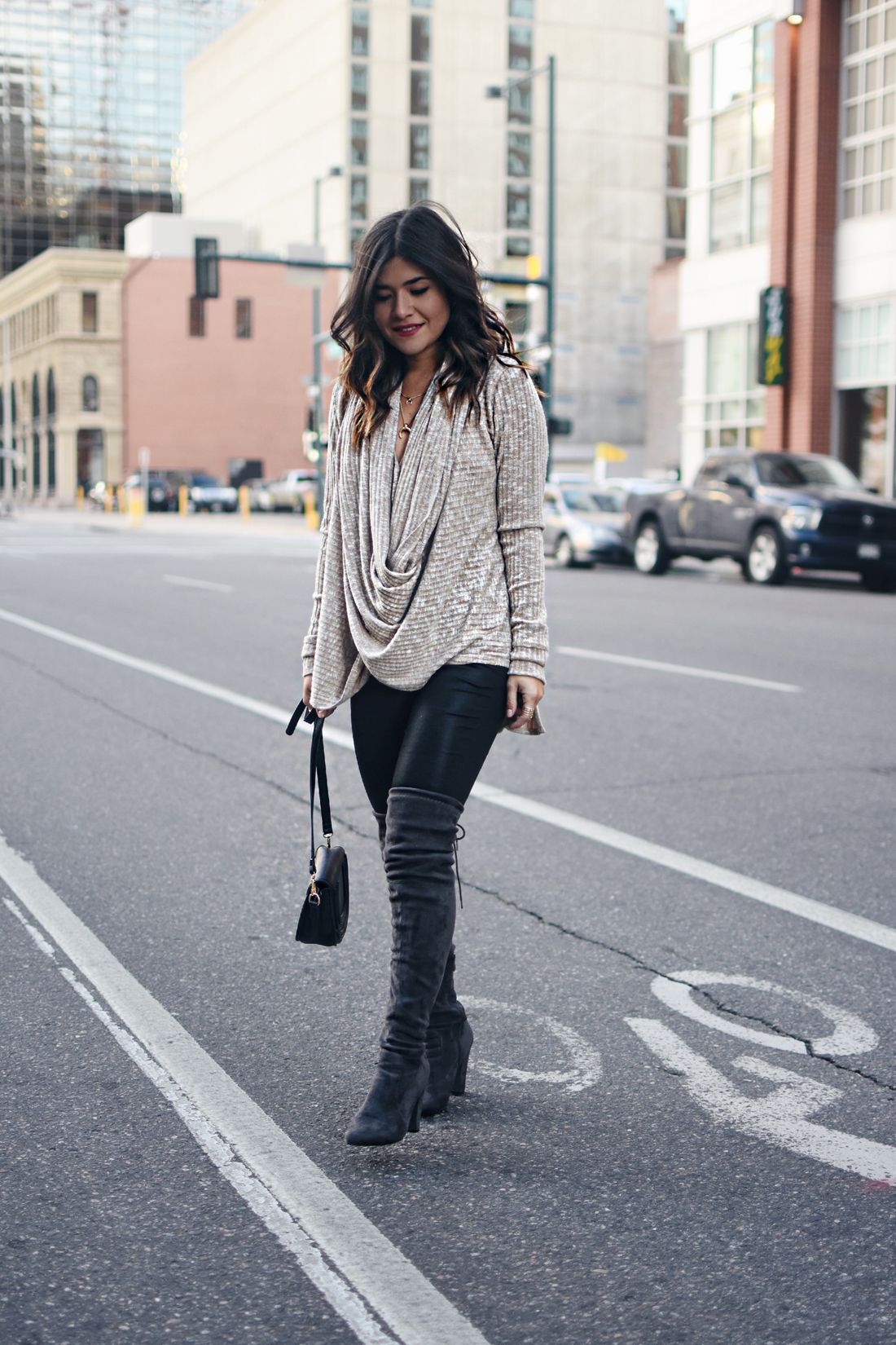 Carolina Hellal of Chic Talk wearing the Jessica sweater via Evy's tree, Public Desire over the high boots, and Madewell coated jeans.