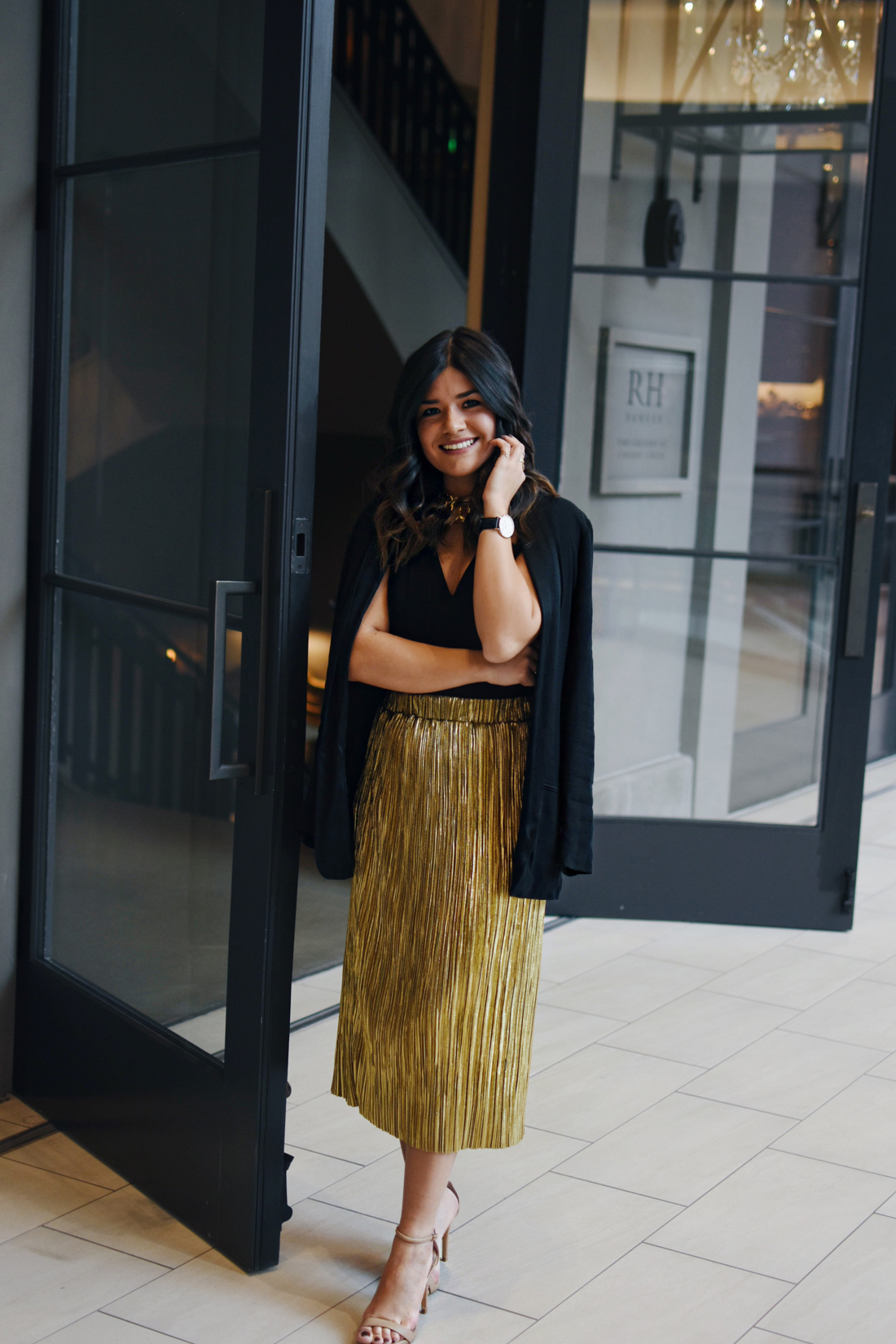 Carolina Hellal of Chic Talk wearing a gold pelated skirt, black h&m blazer at Cherry Creek mall in Denver