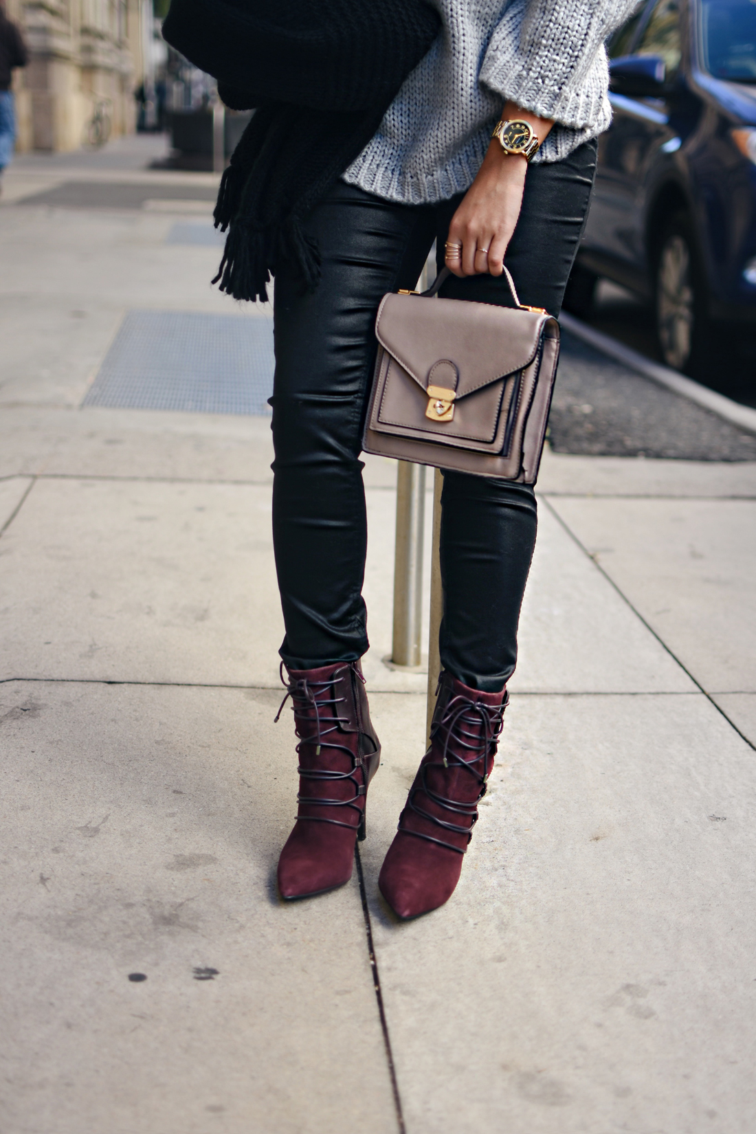 Carolina Hellal of Chic Talk wearing a Chicwish grey knit sweater, Rayban aviator sunglasses, Madewell coated skinny jeans and Nine West burgundy booties