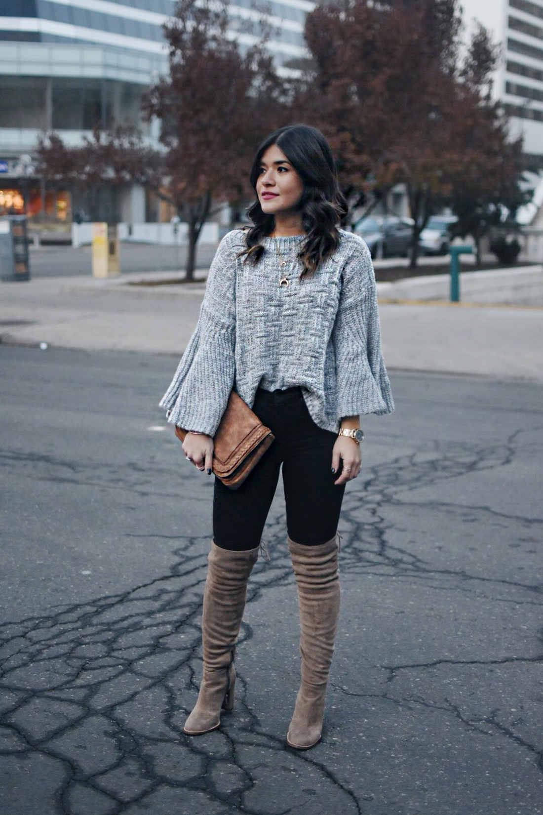 Carolina Hellal of Chic Talk wearing  Shein Grey sweater, black jeans and Vince Camuto over the knee boots.