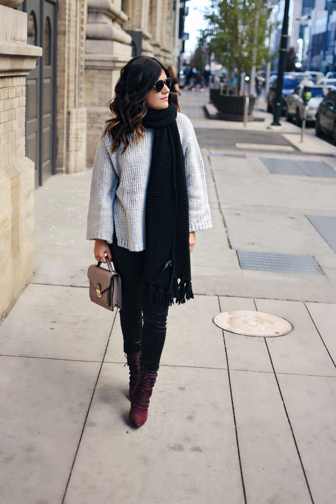 Carolina Hellal of Chic Talk wearing a Chicwish  knit sweater, Madewell coated jeans, Nine West lace up booties and Rayban aviator sunglasses