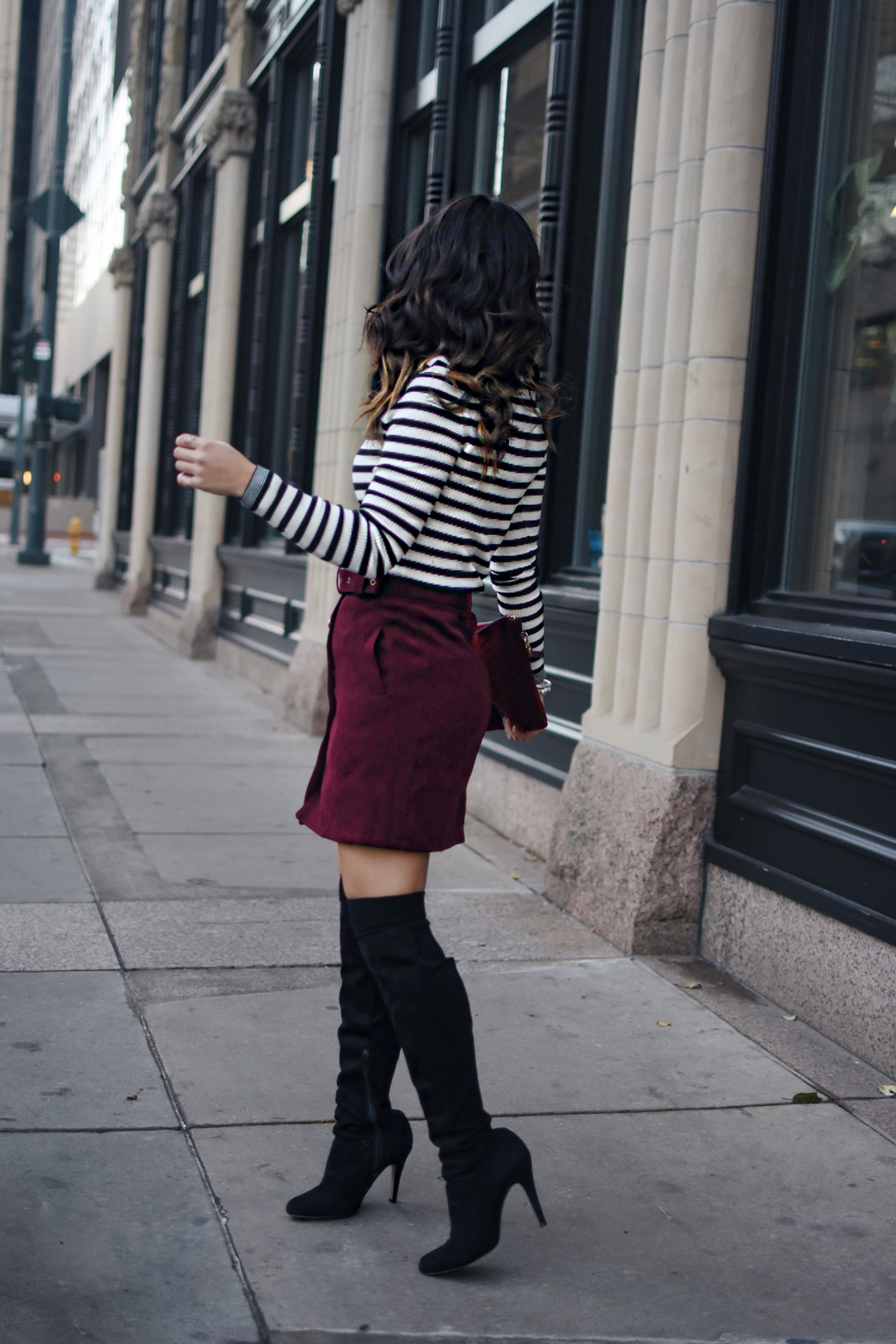 Carolina Hellal of Chic Talk wearing a SheIn burgundy mini skirt, Gap ribbed turtleneck sweater and black boots
