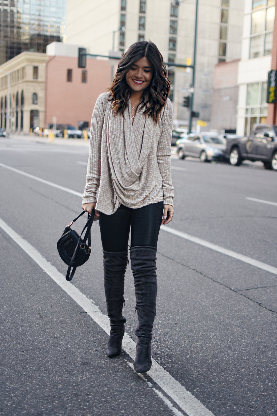 Carolina Hellal of Chic Talk wearing the Jessica sweater via Evy's tree, Public Desire over the high boots, and Madewell coated jeans.