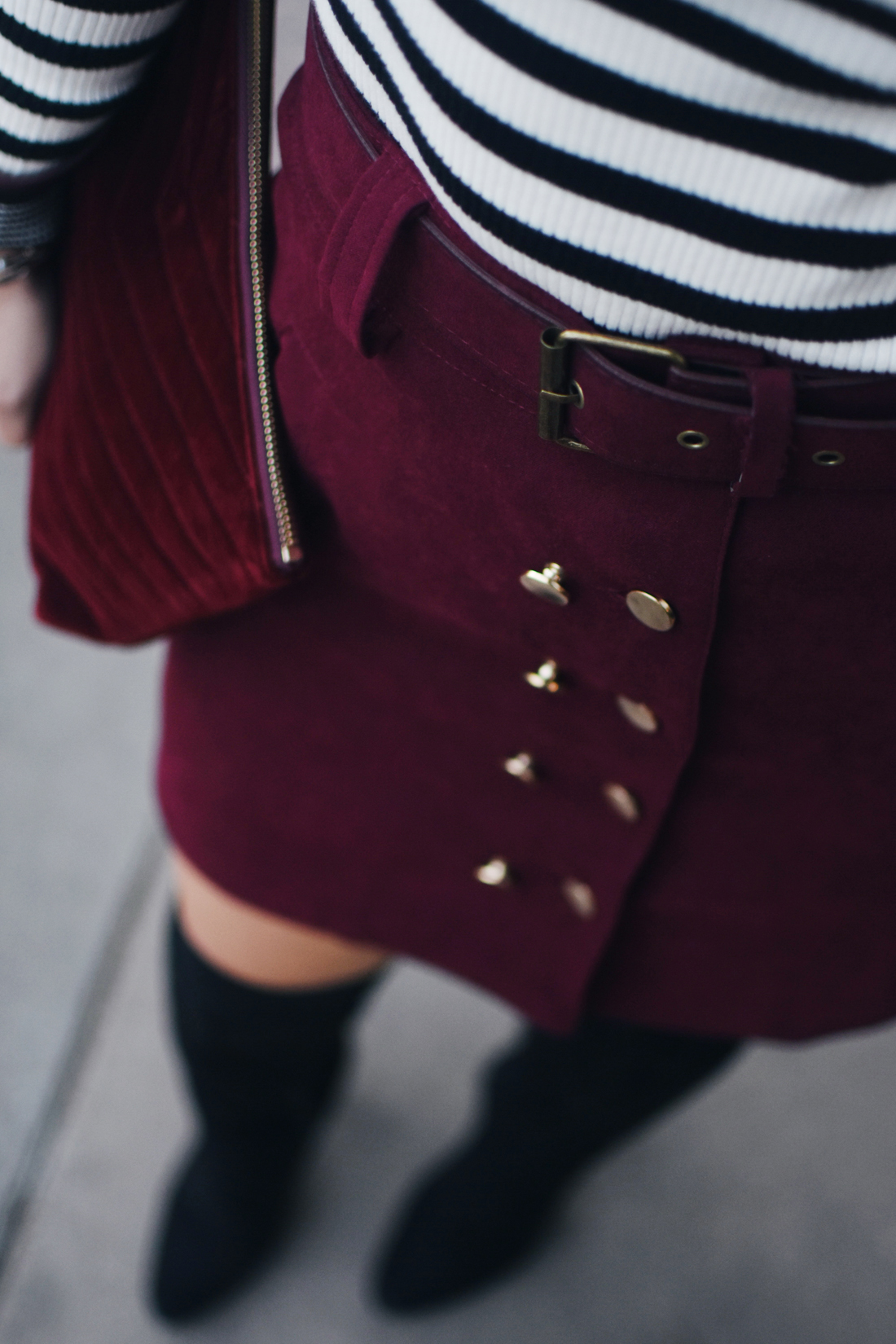 Carolina Hellal of Chic Talk wearing a SheIn burgundy mini skirt, Gap ribbed turtleneck sweater and black boots