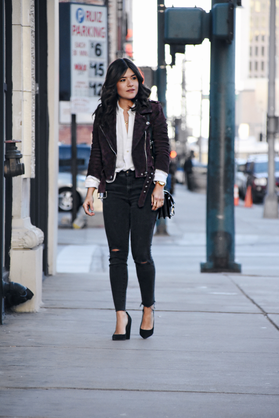 Carolina Hellal of Chic Talk wearing a Suede jacket, free people top, Madewell jeans, Rebecca Minkoff bag, and Sam Edelman shoes