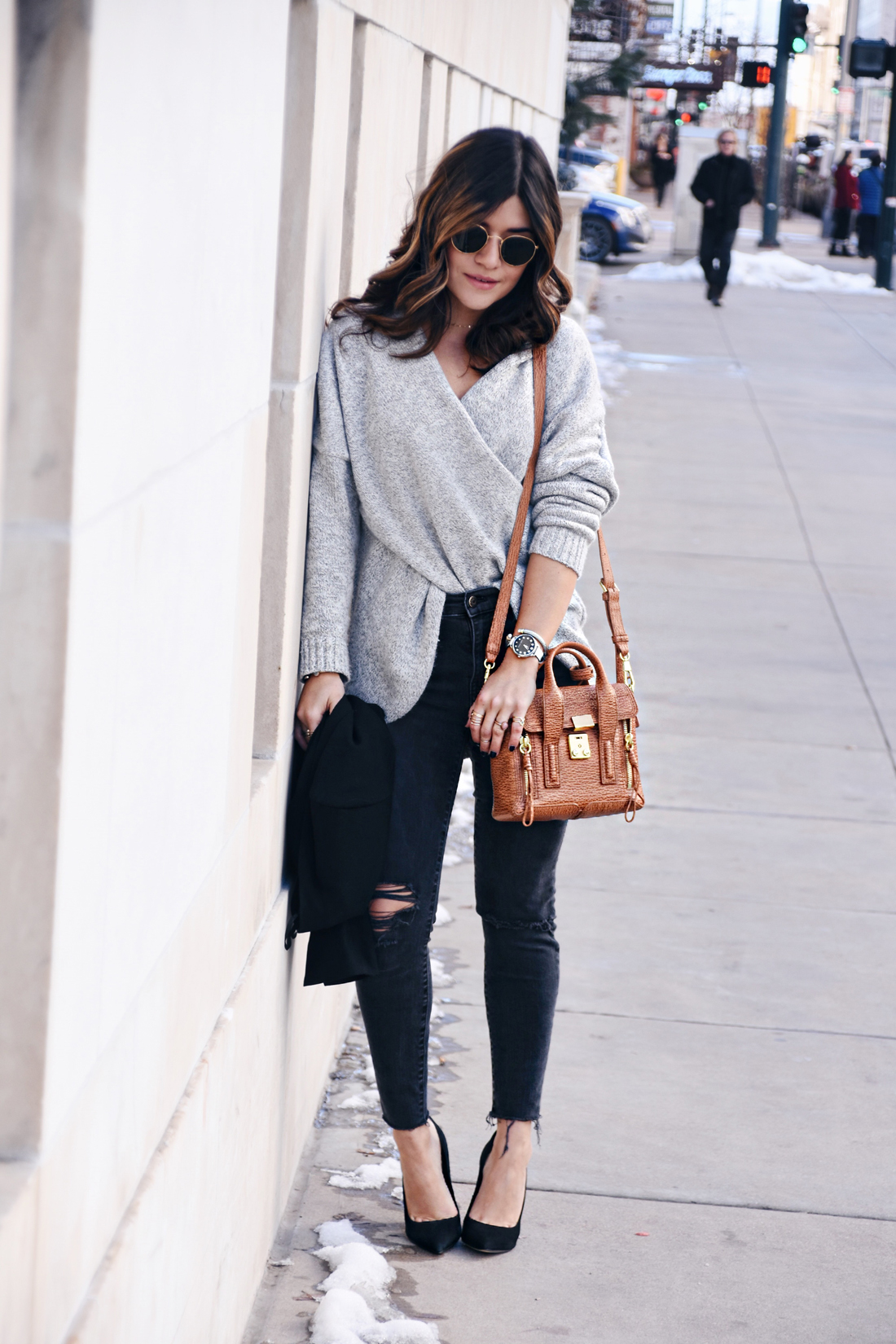 Carolina Hellal of Chic Talk wearing Madewell jeans, Rayban Sunglasses, 3.1 Phillip Lim bag, Steve Madden pumps, and Chicwish cross front sweater
