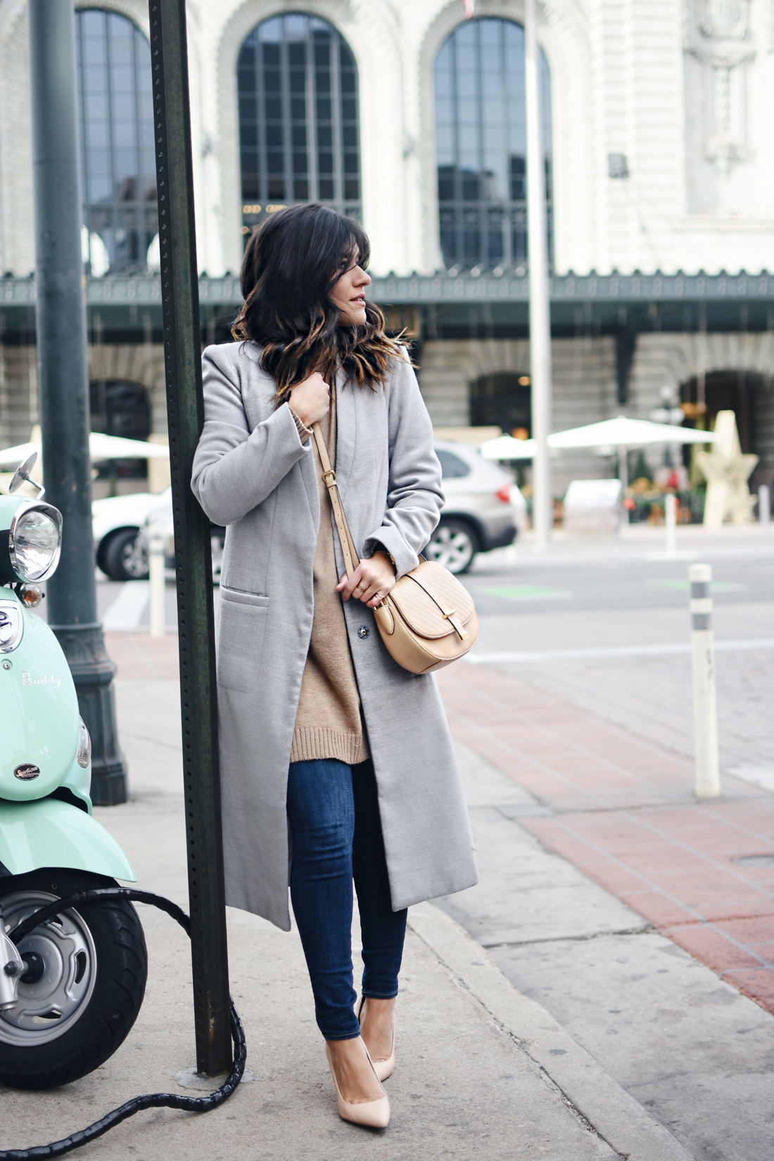 Carolina Hellal of Chic Talk wearing a Shein gray long coat, Paige skinny jeans, Calvin Klein bag, NA-KD sweater, and Sam Edelman Shoes.