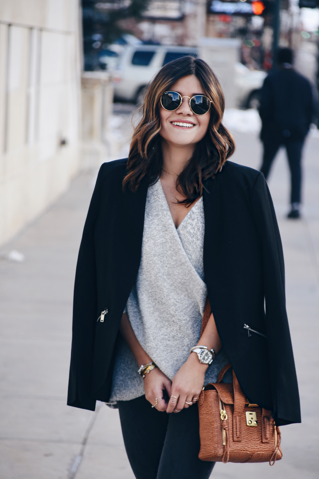 Carolina Hellal of Chic Talk wearing Madewell jeans, Rayban Sunglasses, 3.1 Phillip Lim bag, Steve Madden pumps, and Chicwish cross front sweater
