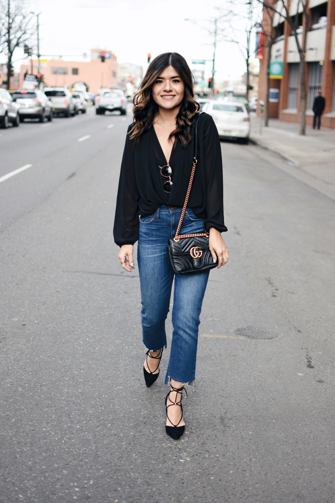Carolina Hellal of Chic Talk wearing a Gucci Marmont bag, Madewell jeans, Forever 21 crossfront black top and Aldo black lace up pumps