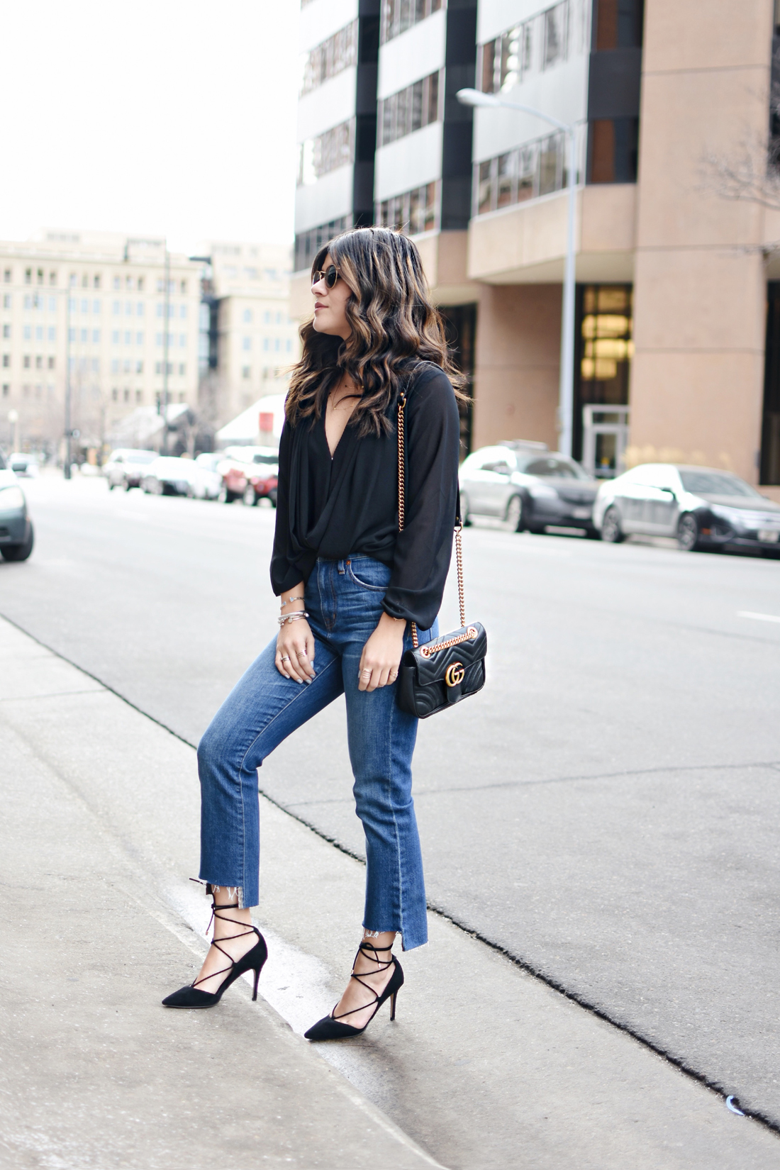 Carolina Hellal of Chic Talk wearing a Gucci Marmont bag, Madewell jeans, Forever 21 crossfront black top and Aldo black lace up pumps