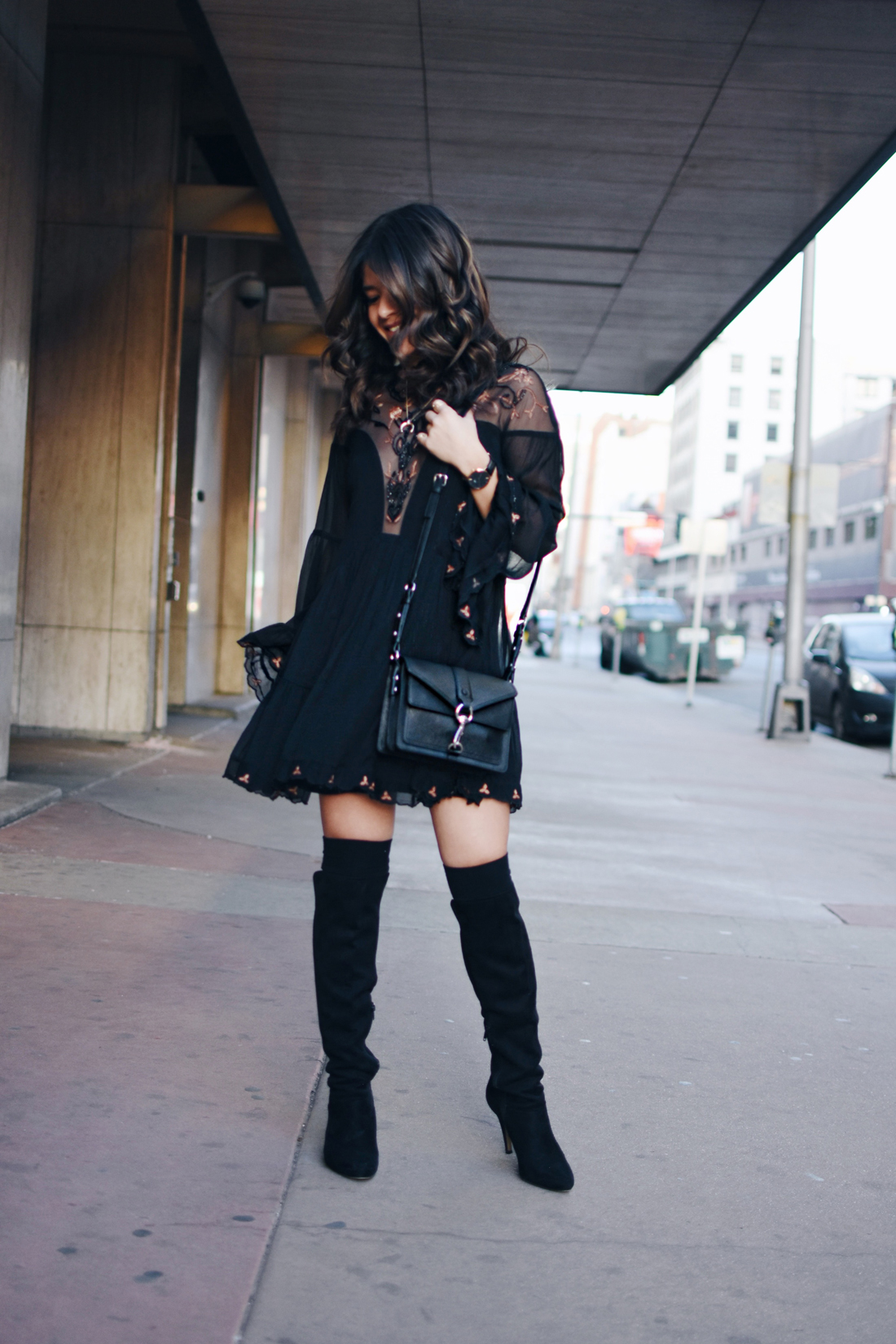 Carolina Hellal of Chic Talk wearing a Free People dress, Rebecca Minkoff crossbody bag and Vince Camuto over the knee black boots