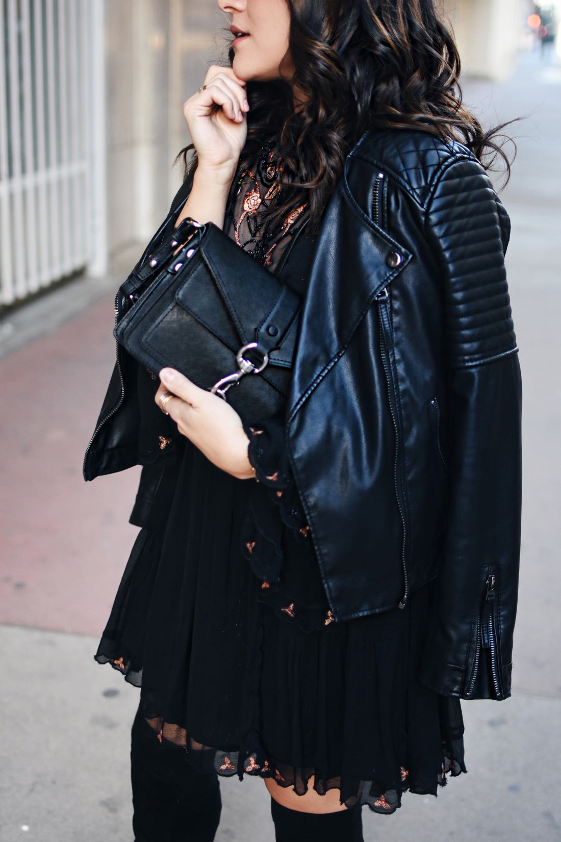 Carolina Hellal of Chic Talk wearing a Free People dress, Rebecca Minkoff crossbody bag and Vince Camuto over the knee black boots