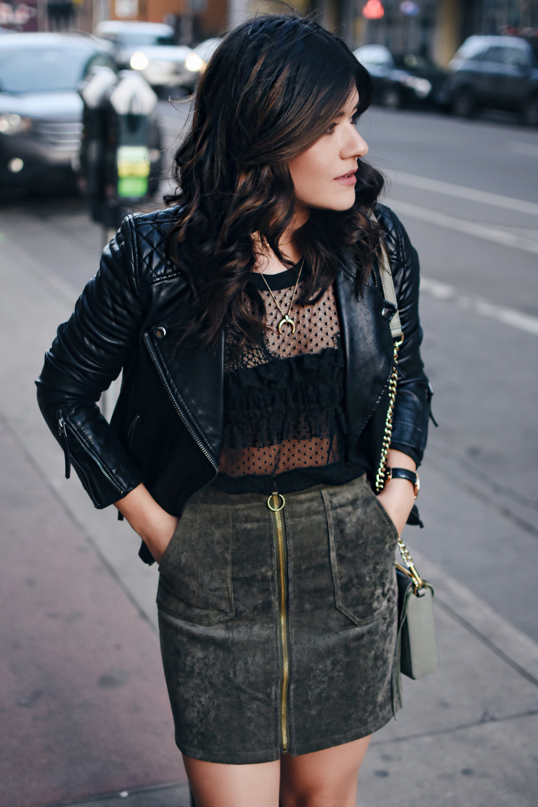 Carolina Hellal of Chictalk wearing a Topshop mesh top and faux leather jacket, Chicwish corduroy skirt, Rebecca Minkoff bag, and strap sandals