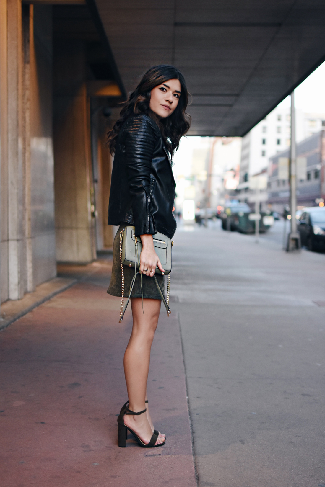 Carolina Hellal of Chictalk wearing a Topshop mesh top and faux leather jacket, Chicwish corduroy skirt, Rebecca Minkoff bag, and strap sandals