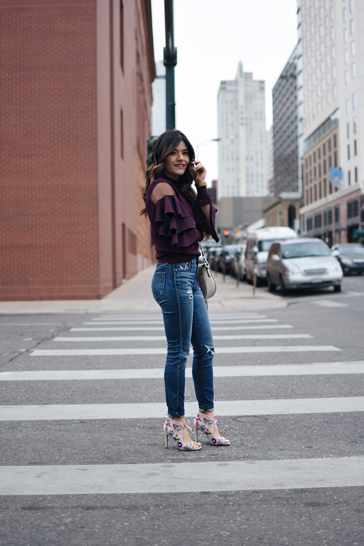 Carolina Hellal of Chic Talk wearing Madewell jeans, Betsey Johnson shoes via DSW, Chicwish ruffle top, and a Moda Luxe bag
