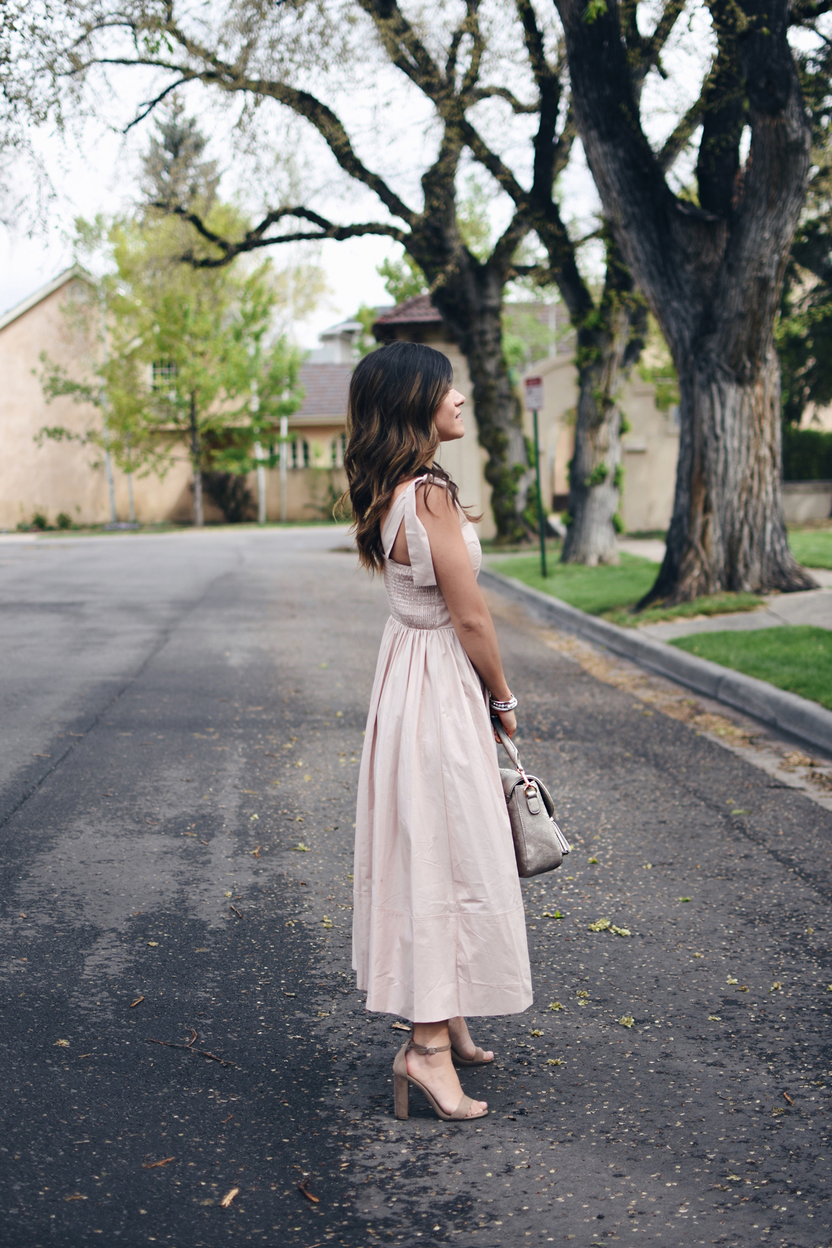 Carolina Hellal of Chic Talk wearing Chicwish blush A lines dress, Steve Madden ankle strap sandals and Moda Luxe bag