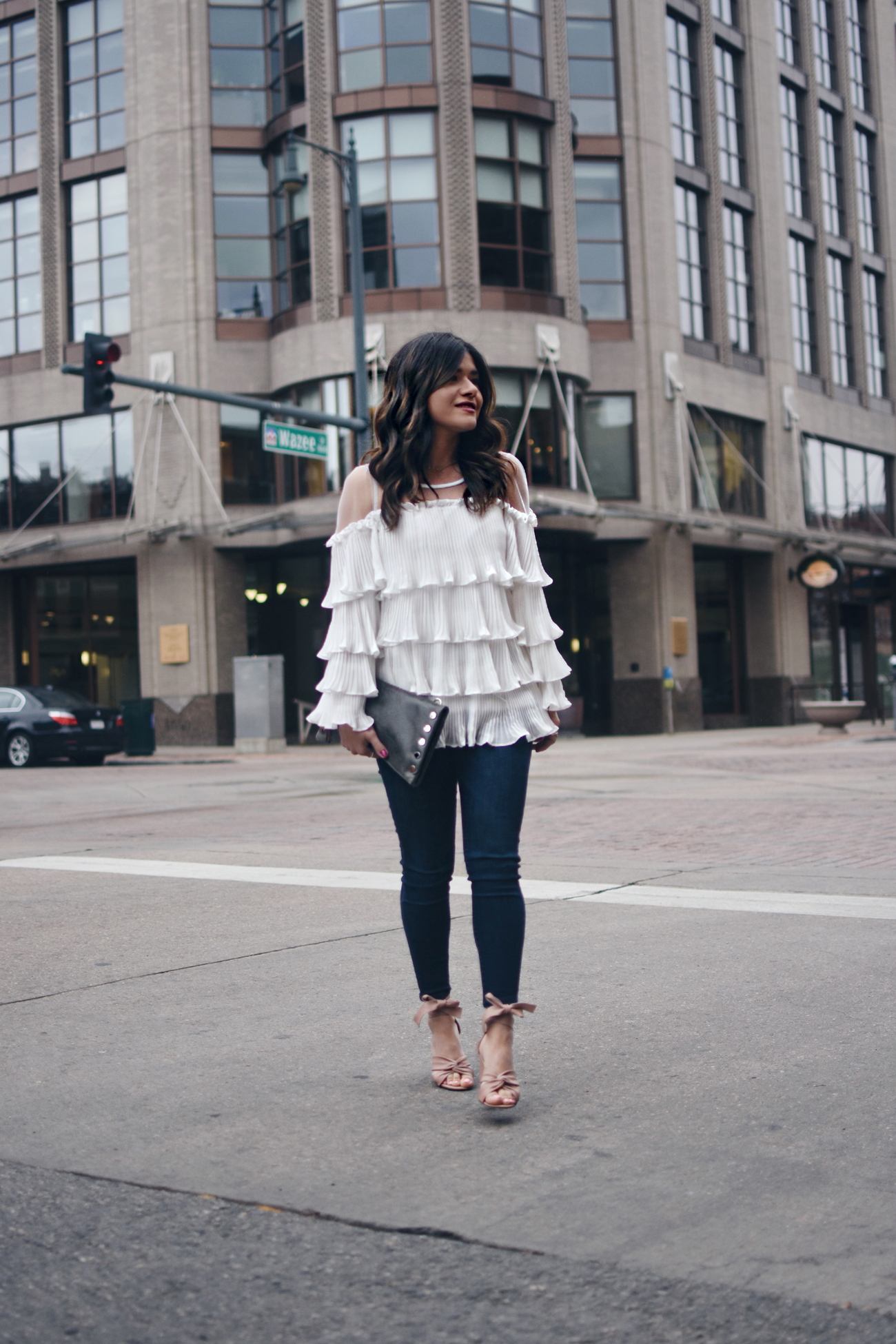 Carolina Hellal of Chic Talk wearing a Chicwish white ruffled, skinny jeans, topshop blush lace up sandals and Hammitt leather clutch