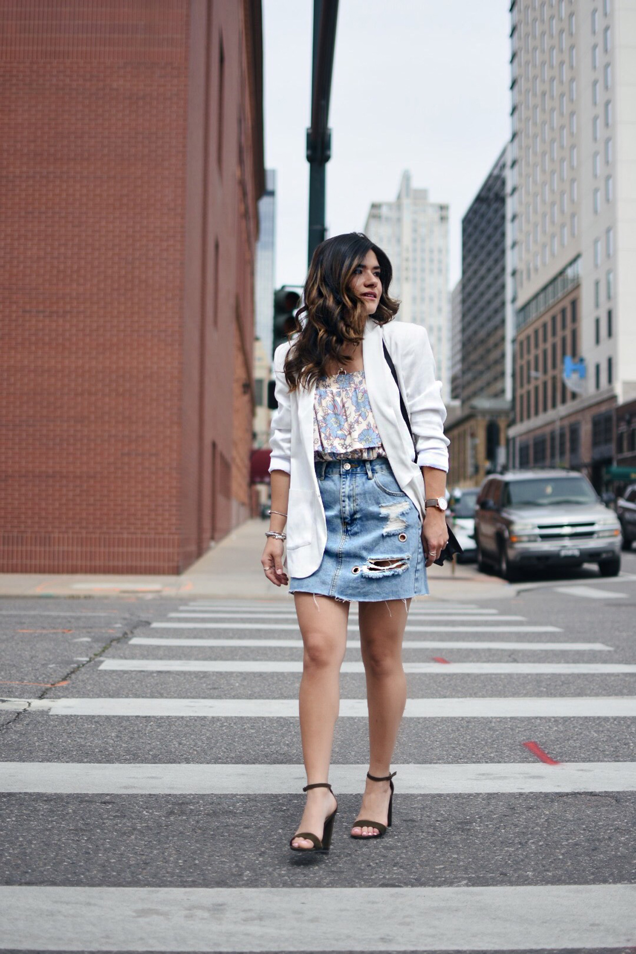 Carolina Hellal of Chic Talk wearing a Forever 21 denim mini skirt, Patterns and pops floral top, Thacker white blazer and Rebecca Minkoff black bag. 