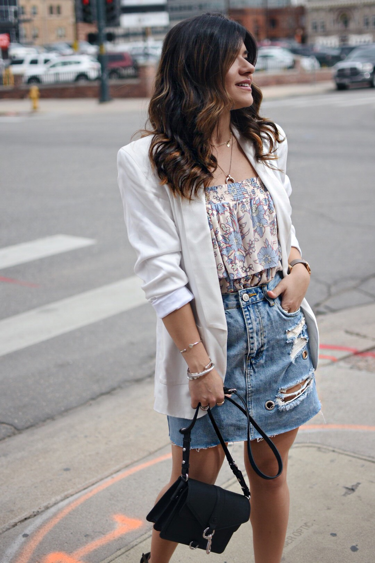 Carolina Hellal of Chic Talk wearing a Forever 21 denim mini skirt, Patterns and pops floral top, Thacker white blazer and Rebecca Minkoff black bag. 
