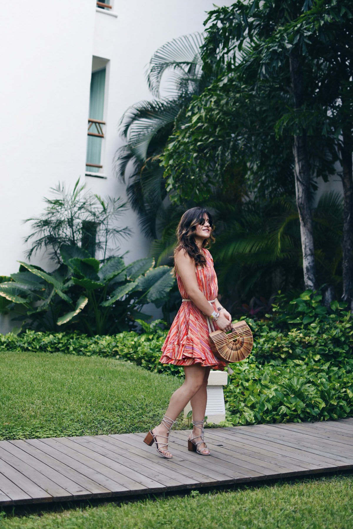 Carolina Hellal of Chic Talk wearing a Free People mini dress, Cultagaia ark bag , Rebecca Minkoff lace up sandals and Rayban sunglasses in Mexico. 