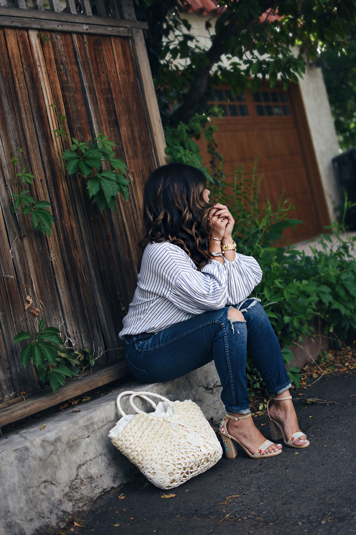 Carolina Hellal of Chic Talk wearing a Shein striped top, Madewell jeans, public Desire sandals and Shein beach bag