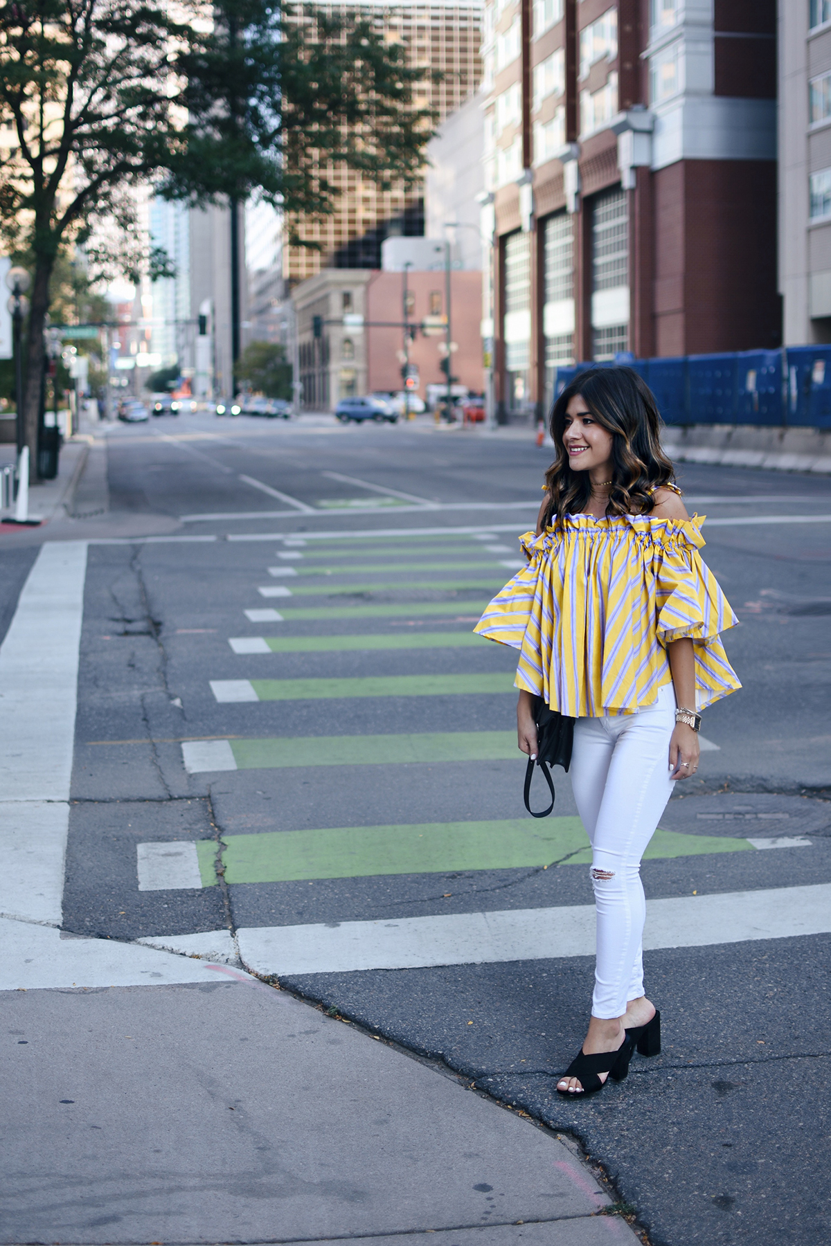 Carolina Hellal of Chic Talk wearing an off the shoulder yellow top via Chicwish, Topshop white jeans and Marc Fisher black slides