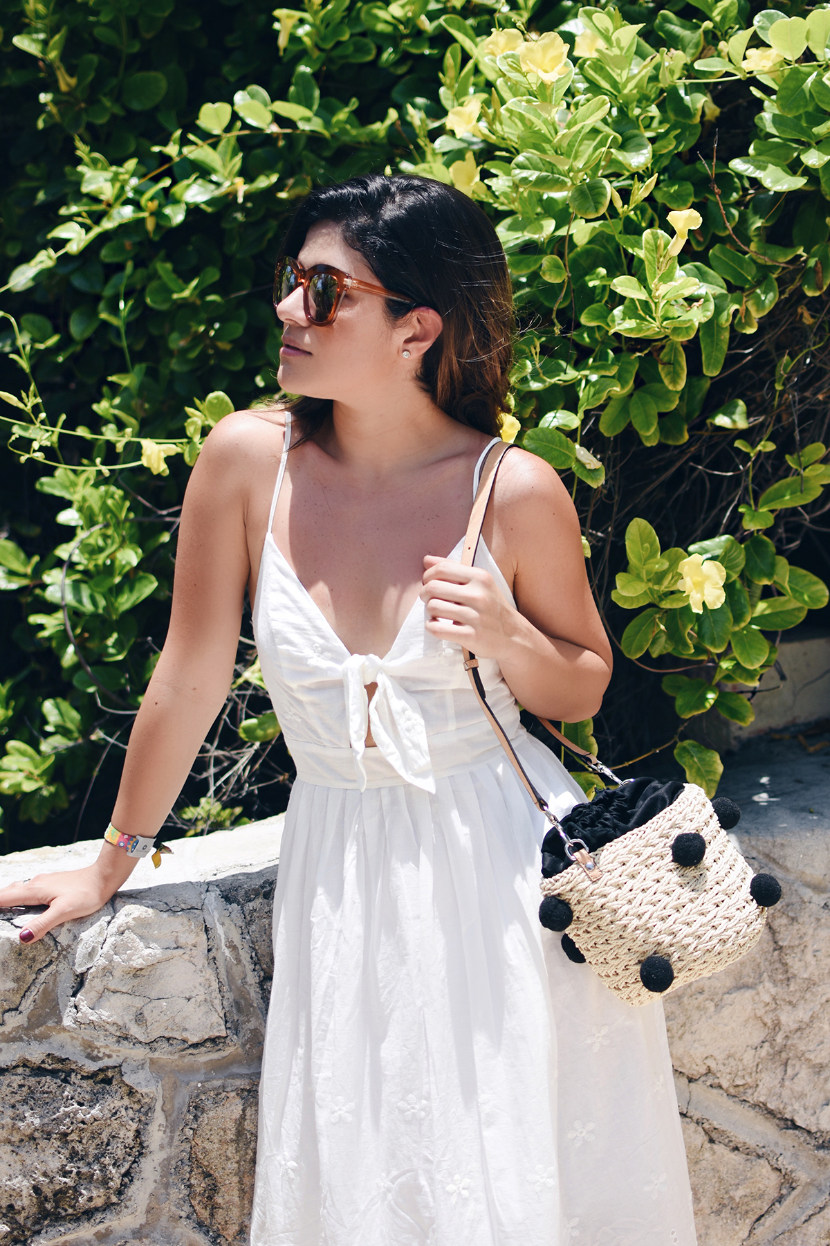 Carolina Hellal of Chic Talk wearing a J.O.A white summer dress, Rebecca Minkoff straw pom pom bag and Forever21 tassel sandals