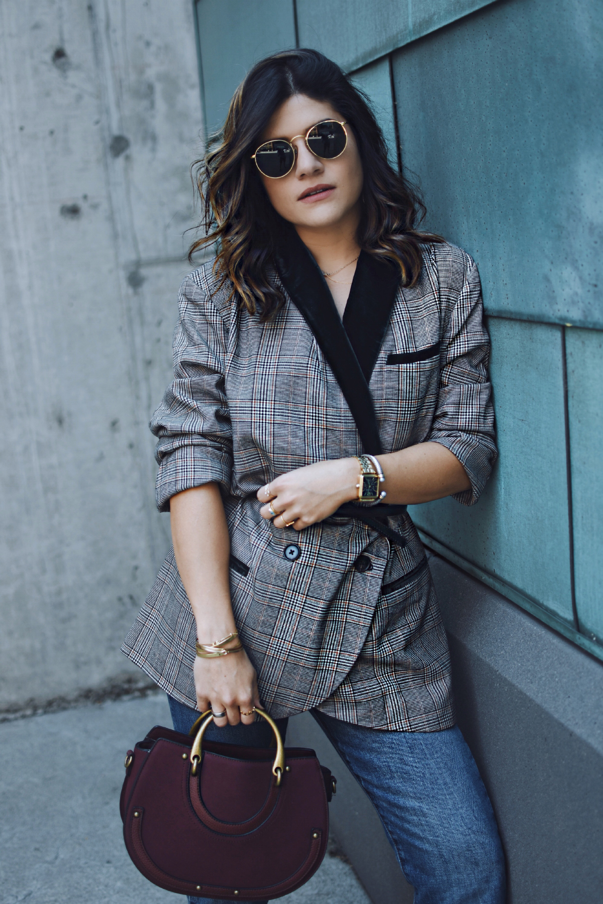 Carolina Hellal of Chic Talk wearing a Free people plaid blazer, Levi's straight jeans and charming charlie bag