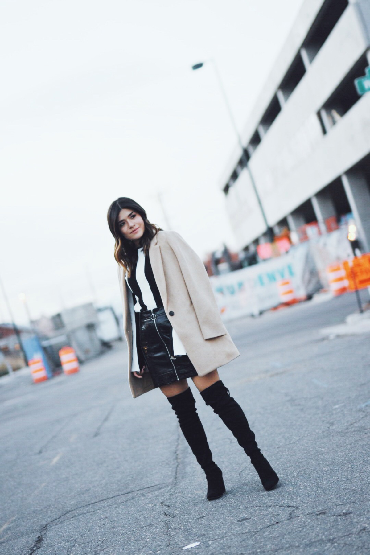 Carolina Hellal of Chic Talk wearing a Topshop skirt and top, Steve Madden boots and Old Navy coat