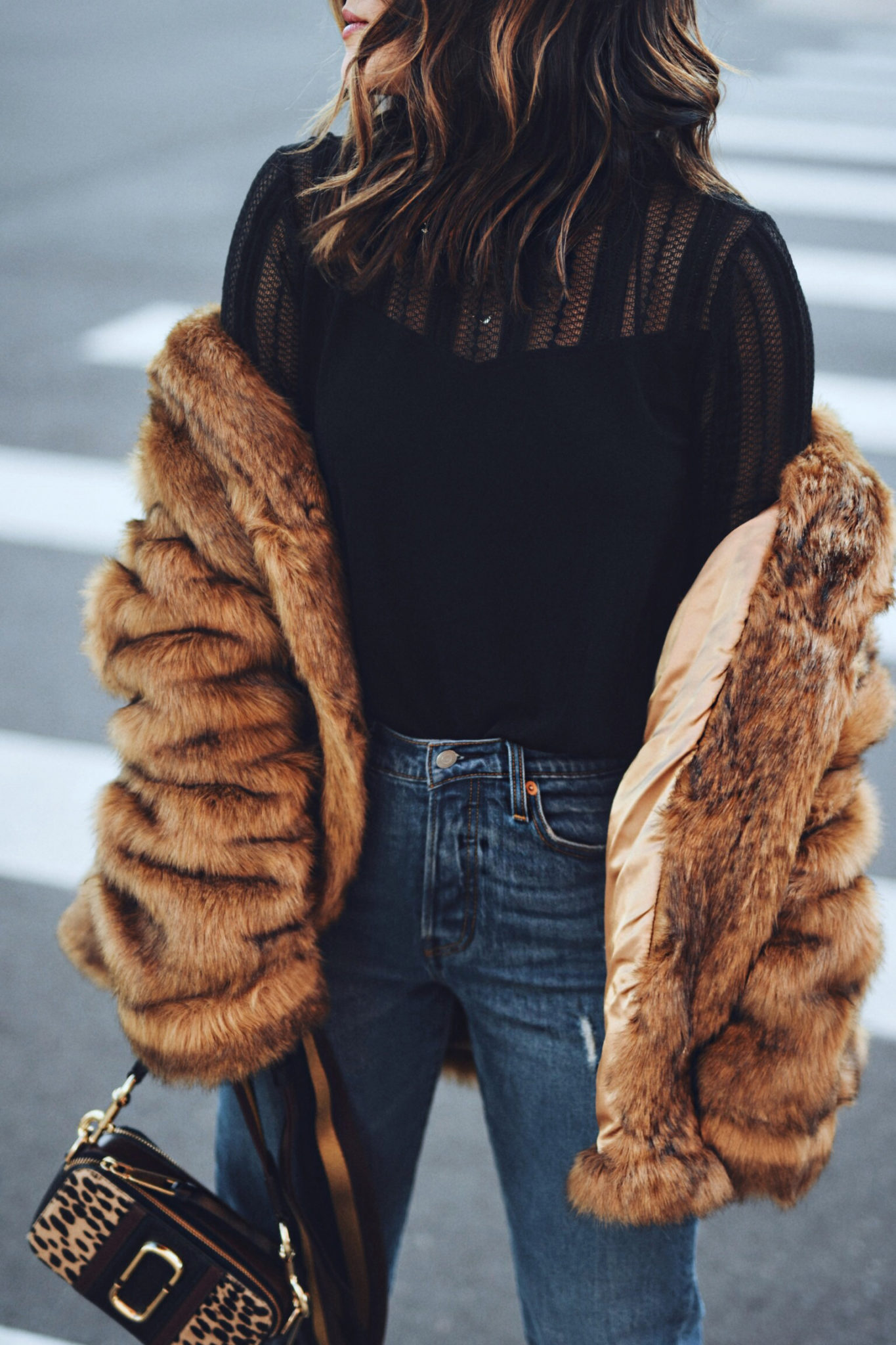 Carolina Hellal of Chic Talk wearing a faux fur coat via ASOS, Levi's jeans, Marc Jacobs crossbody bag and Nine West high heels.