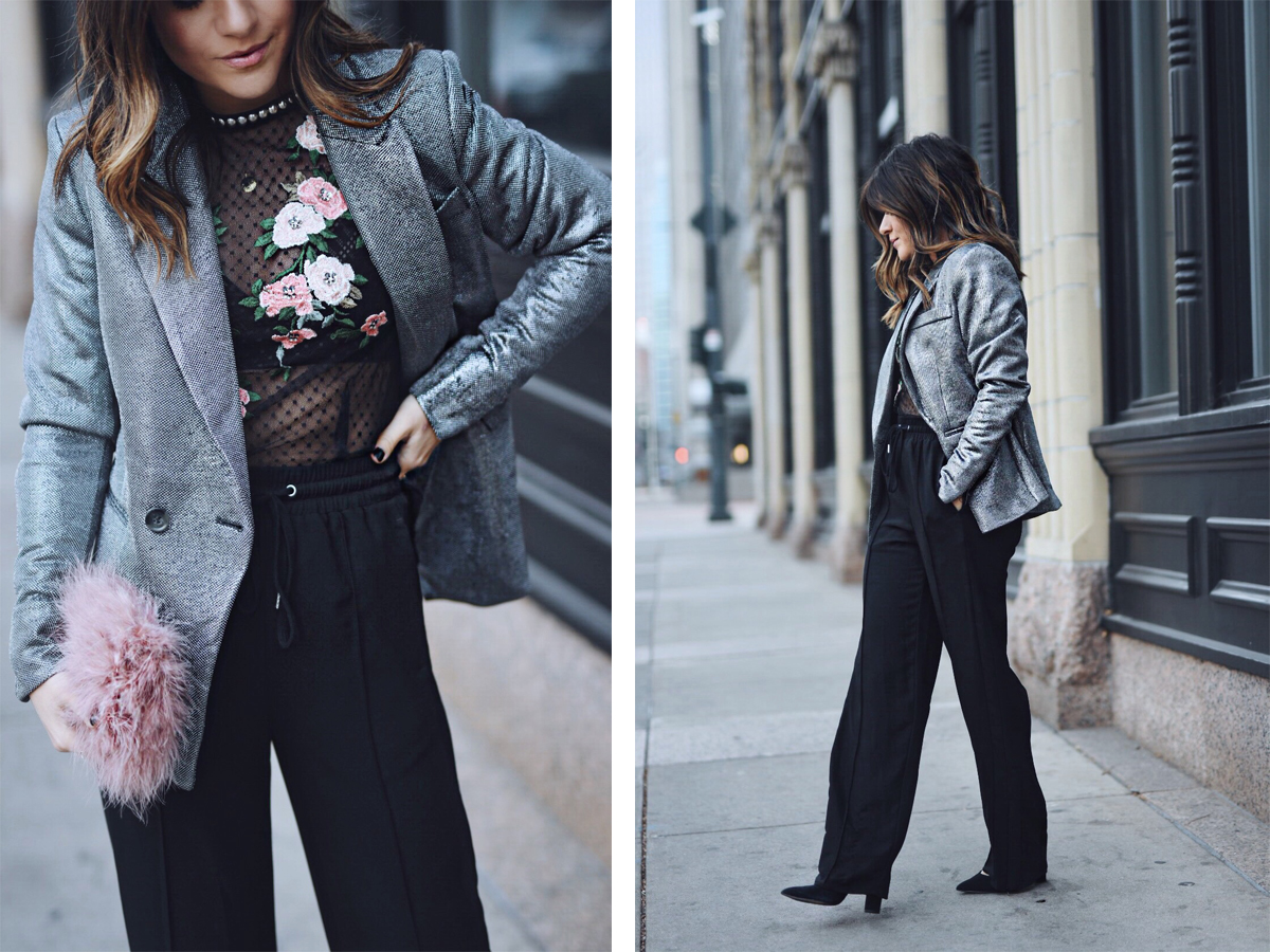 Carolina Hellal of CHIC TALK wearing an H&M silver blazer, black track pants, Topshop lace top and feather bag