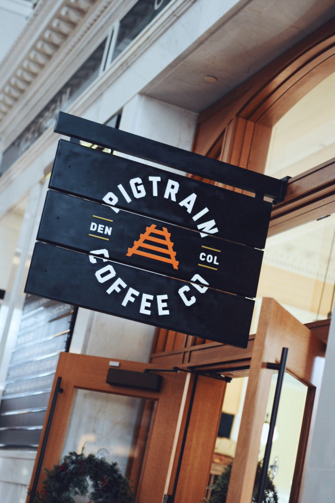 PigTrain Coffee shop in Denver Logo and shop entrance