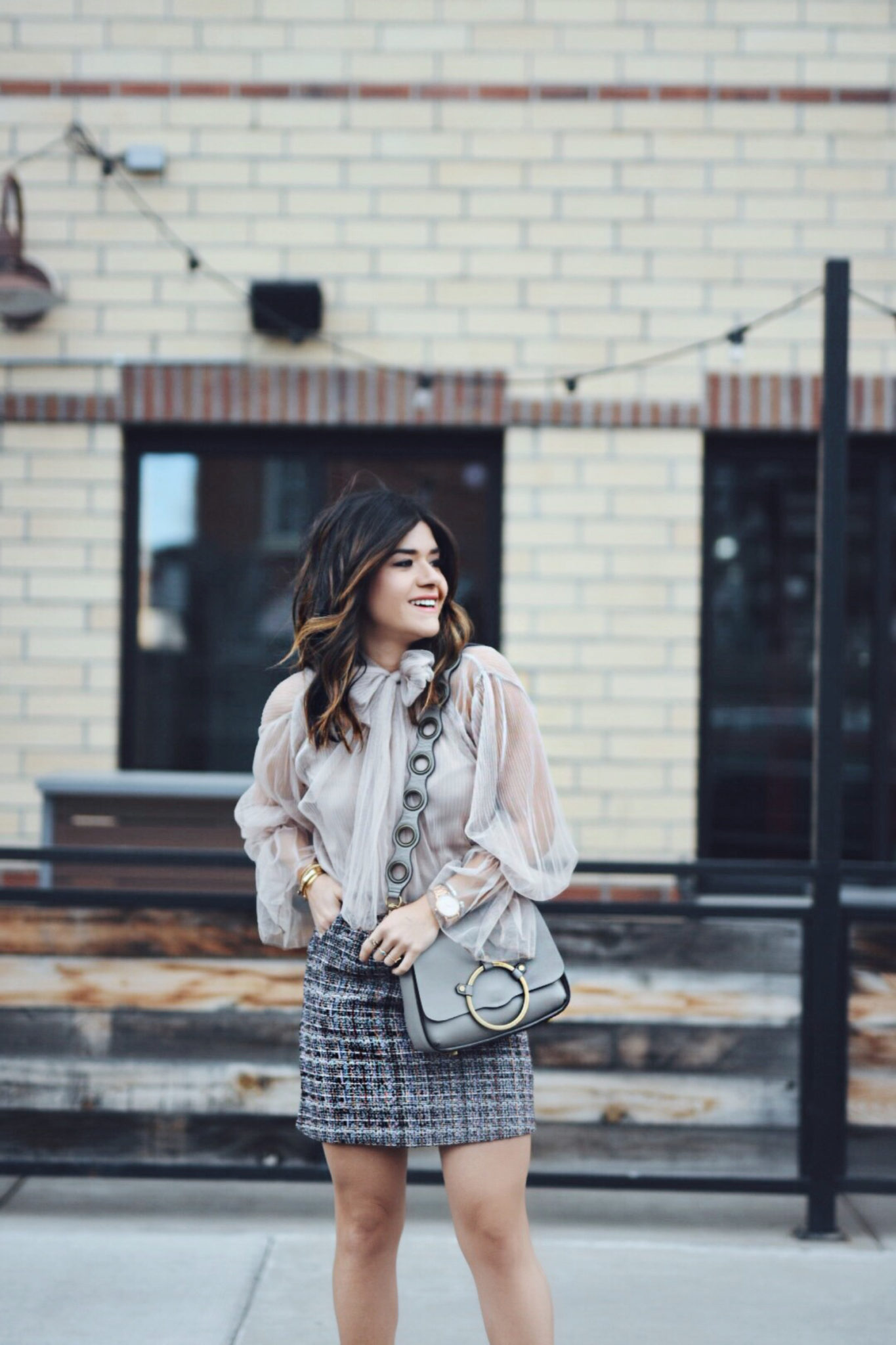 Carolina Hellal of Chic Talk wearing a Chiwish tulle top, Shein tweed skirt, shein gray coat, ASOS red boots and Rebecca Minkoff bag - CHICWISH TULLE TOP by popular Denver fashion blogger Chic Talk