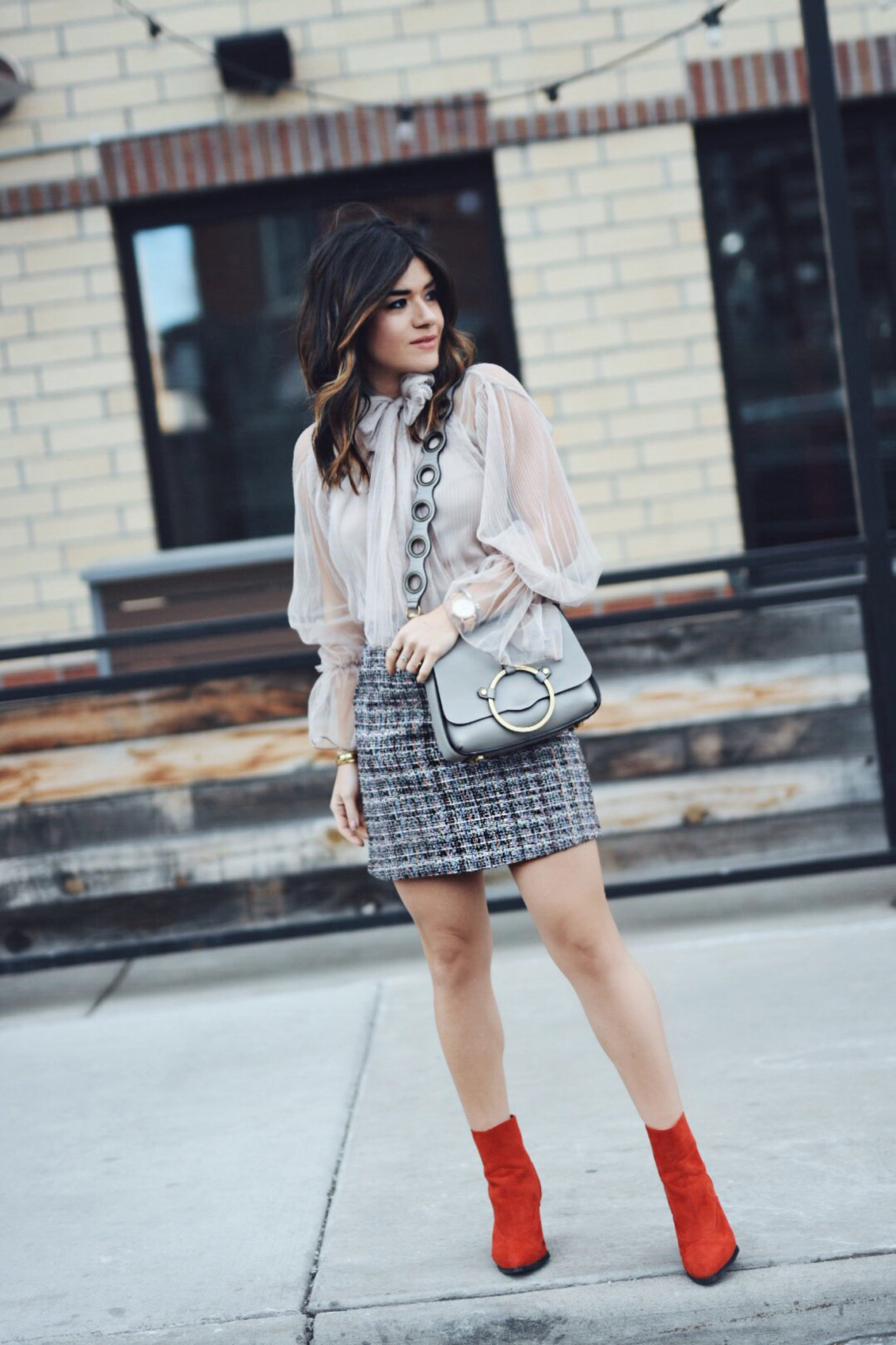 Carolina Hellal of Chic Talk wearing a Chiwish tulle top, Shein tweed skirt, shein gray coat, ASOS red boots and Rebecca Minkoff bag - CHICWISH TULLE TOP by popular Denver fashion blogger Chic Talk